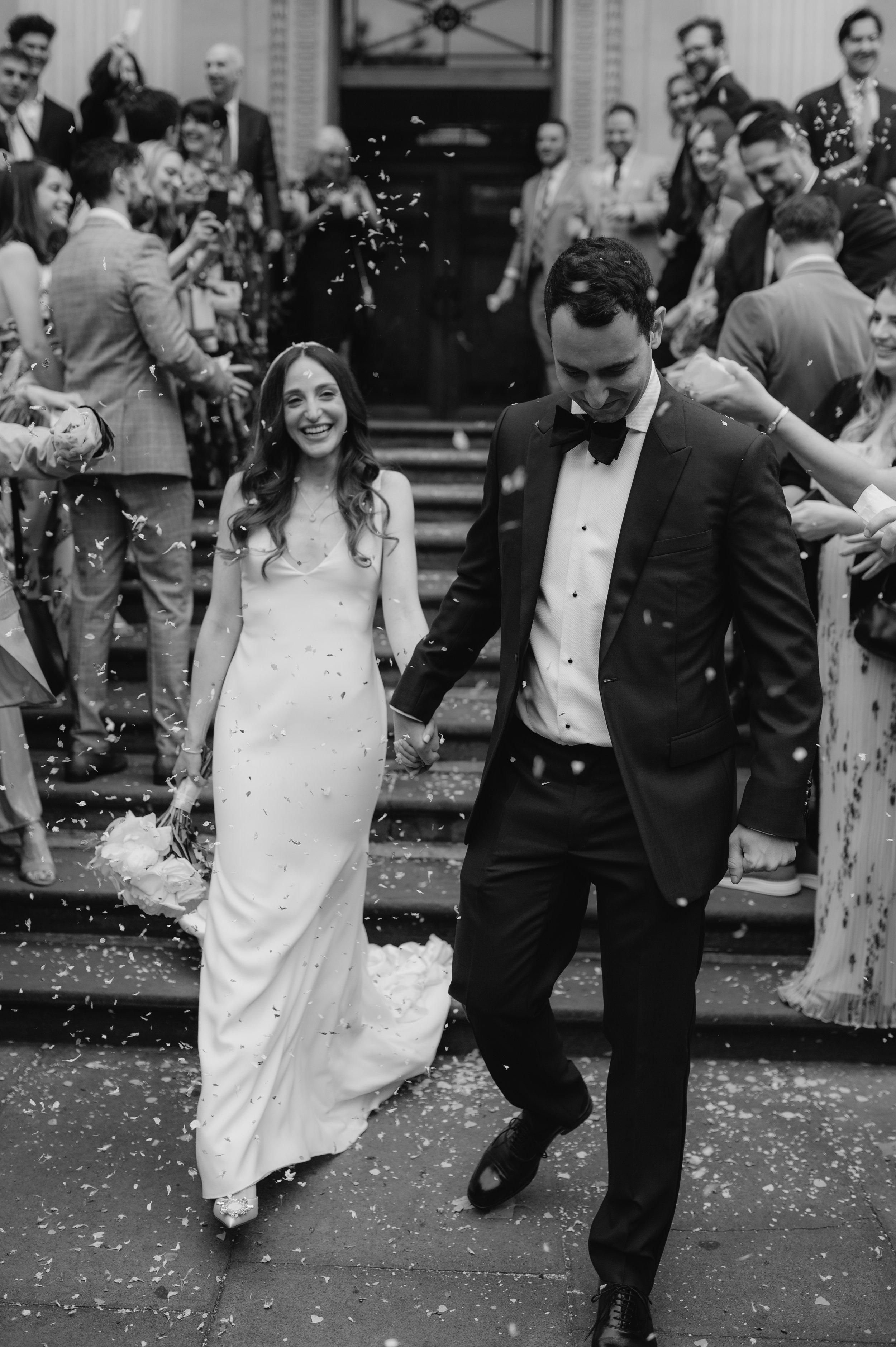 London wedding photography at Marylebone Town Hall bride and groom in confetti tunnel
