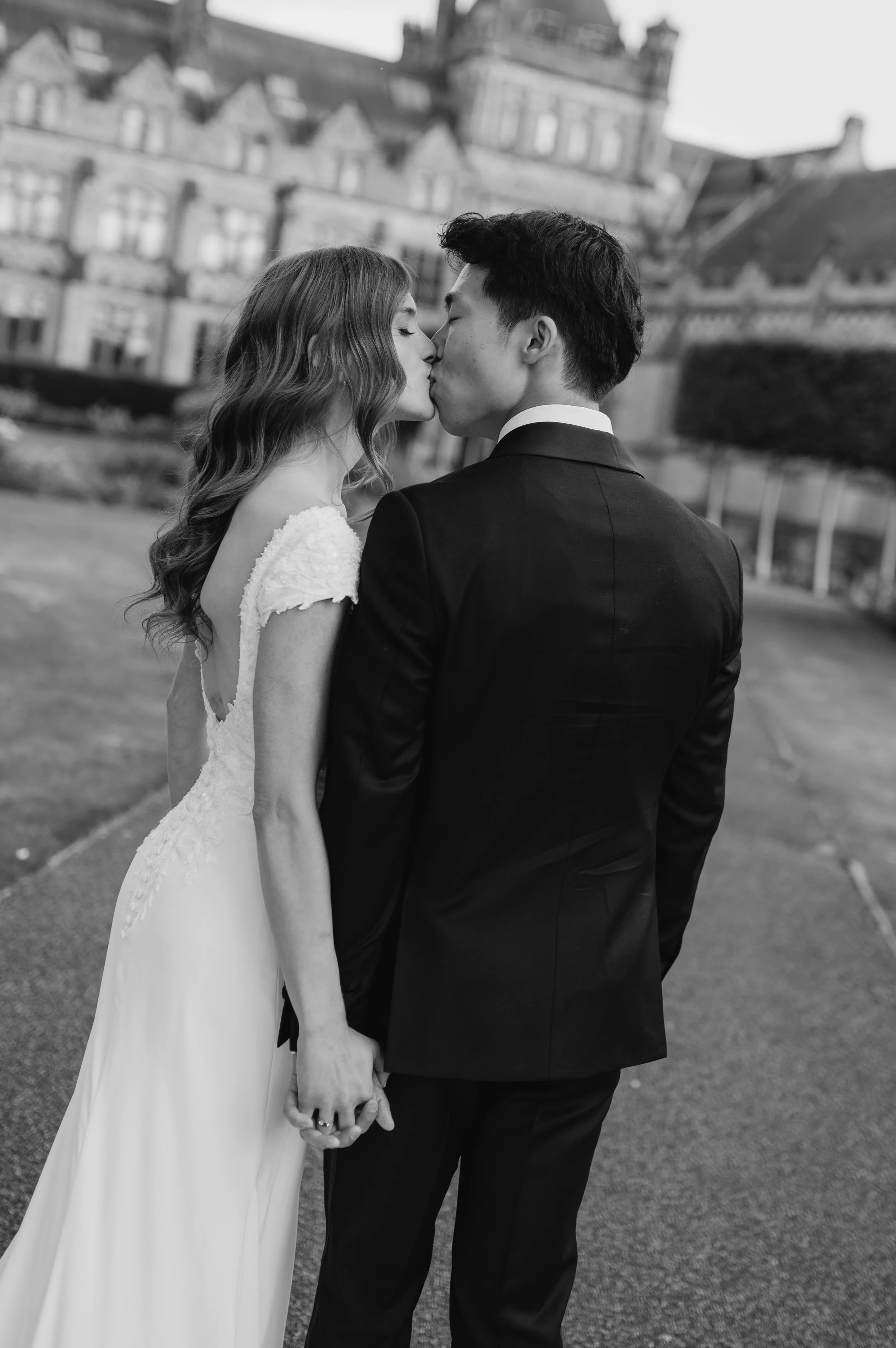 bride and groom kiss at wedding in Surrey