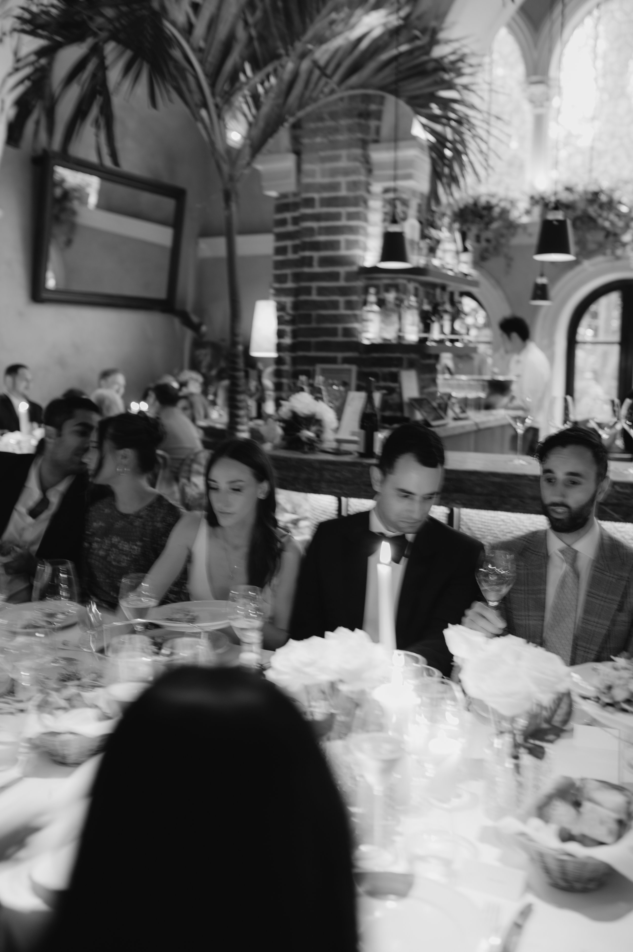 candlelit dinner London wedding photography at Belvedere in Holland Park bride and groom eating 