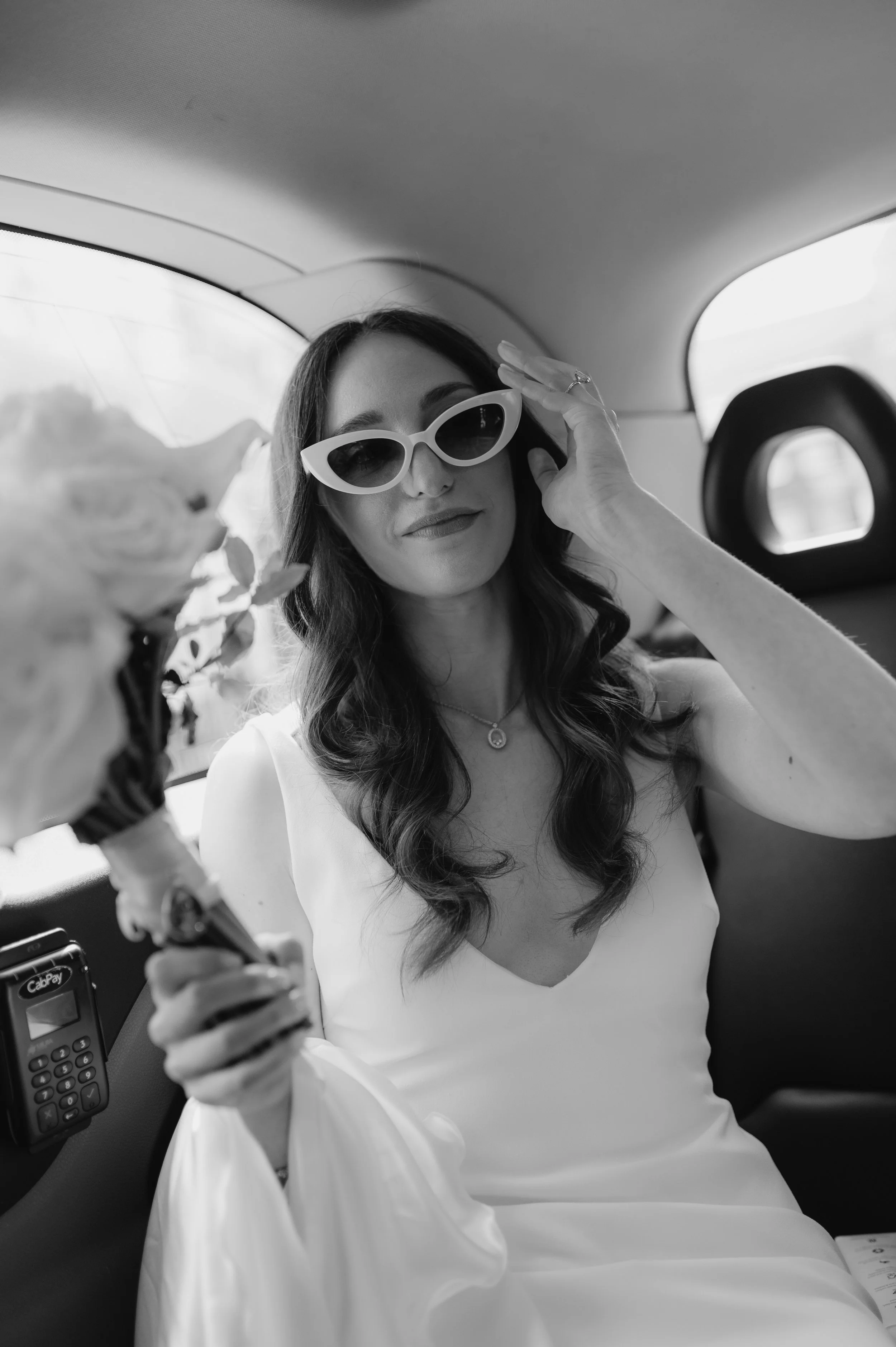 London wedding photography at Marylebone Town Hall bride putting sunglasses on