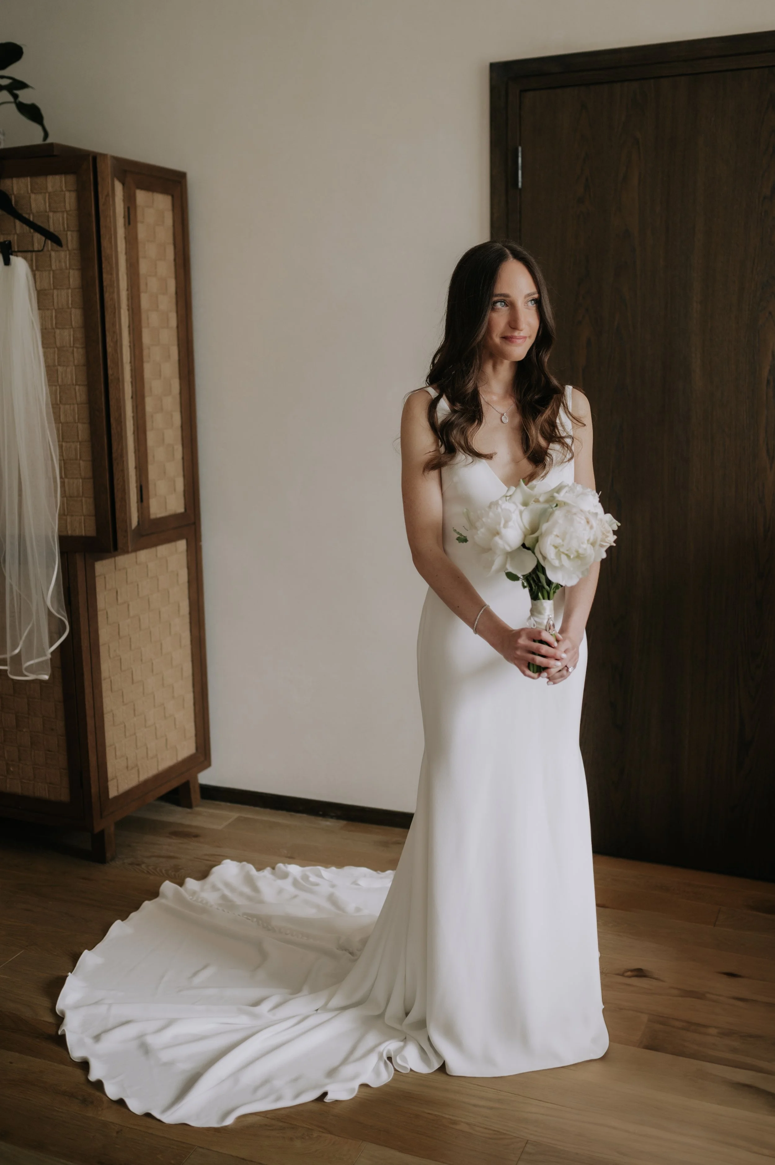 London wedding photography at Marylebone Town Hall bride holding flower bouquet 