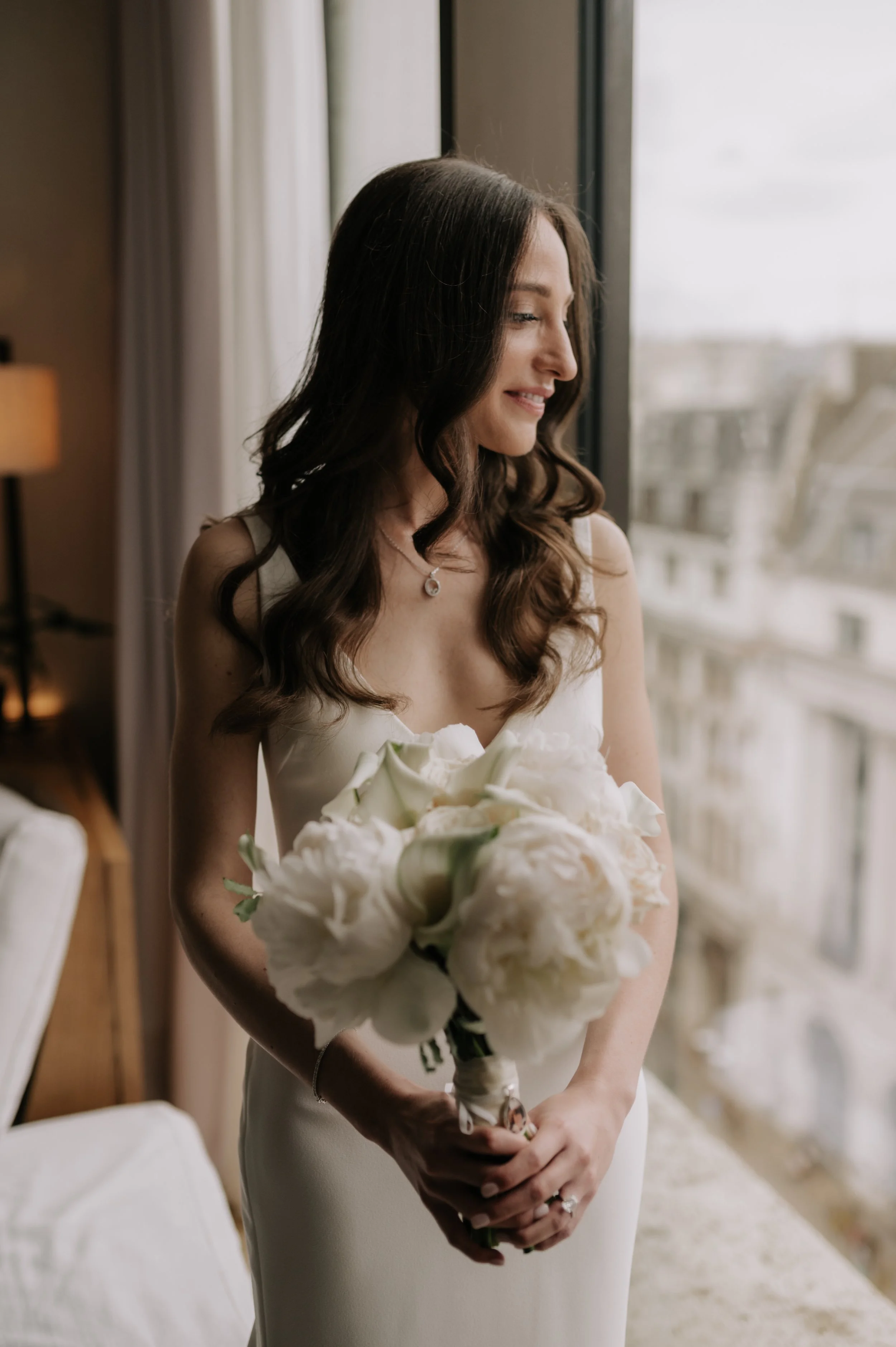 London wedding photography at Marylebone Town Hall bride looking out window