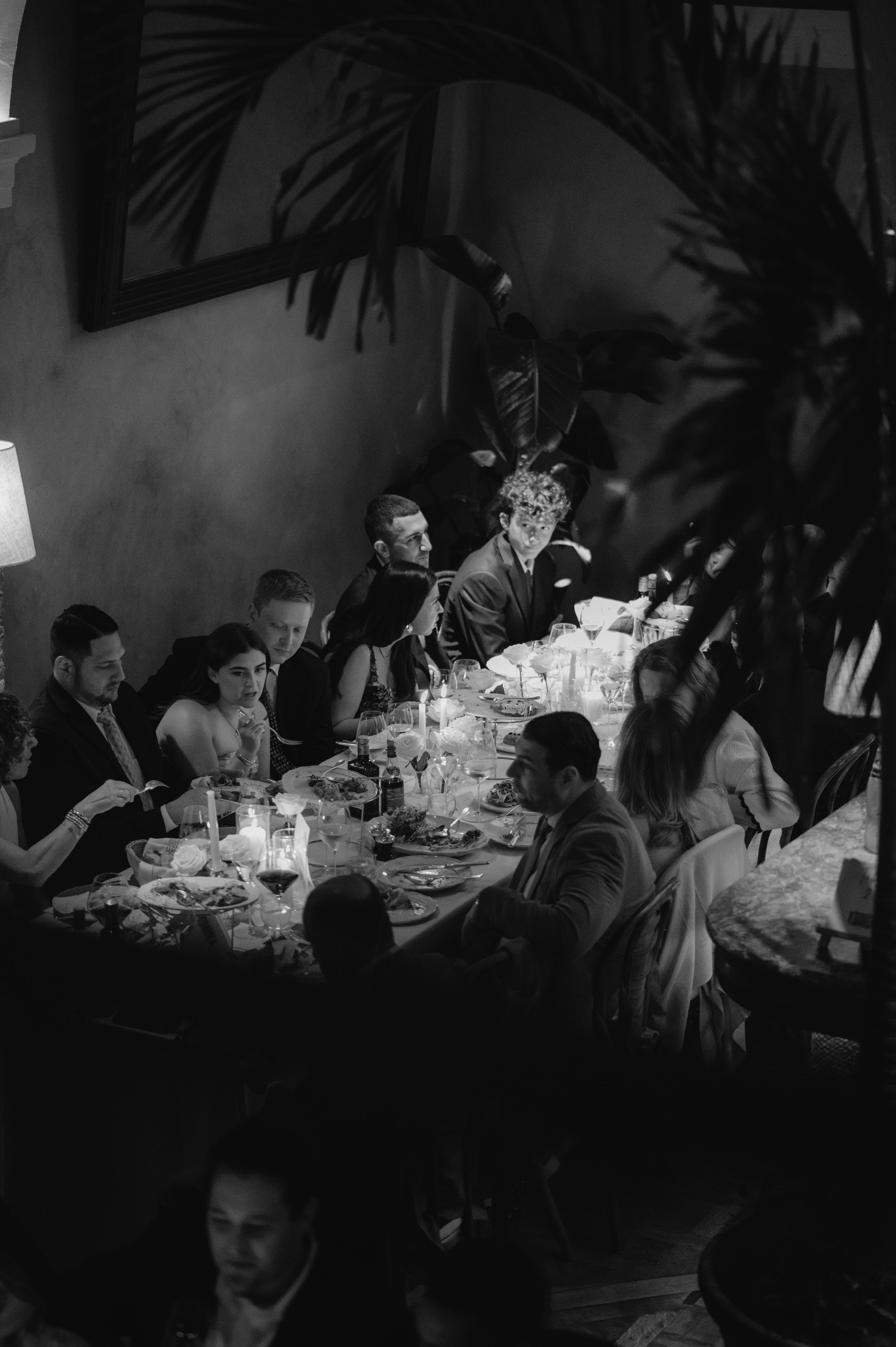 candlelit dinner London wedding photography at Belvedere in Holland Park guests chatting around table 