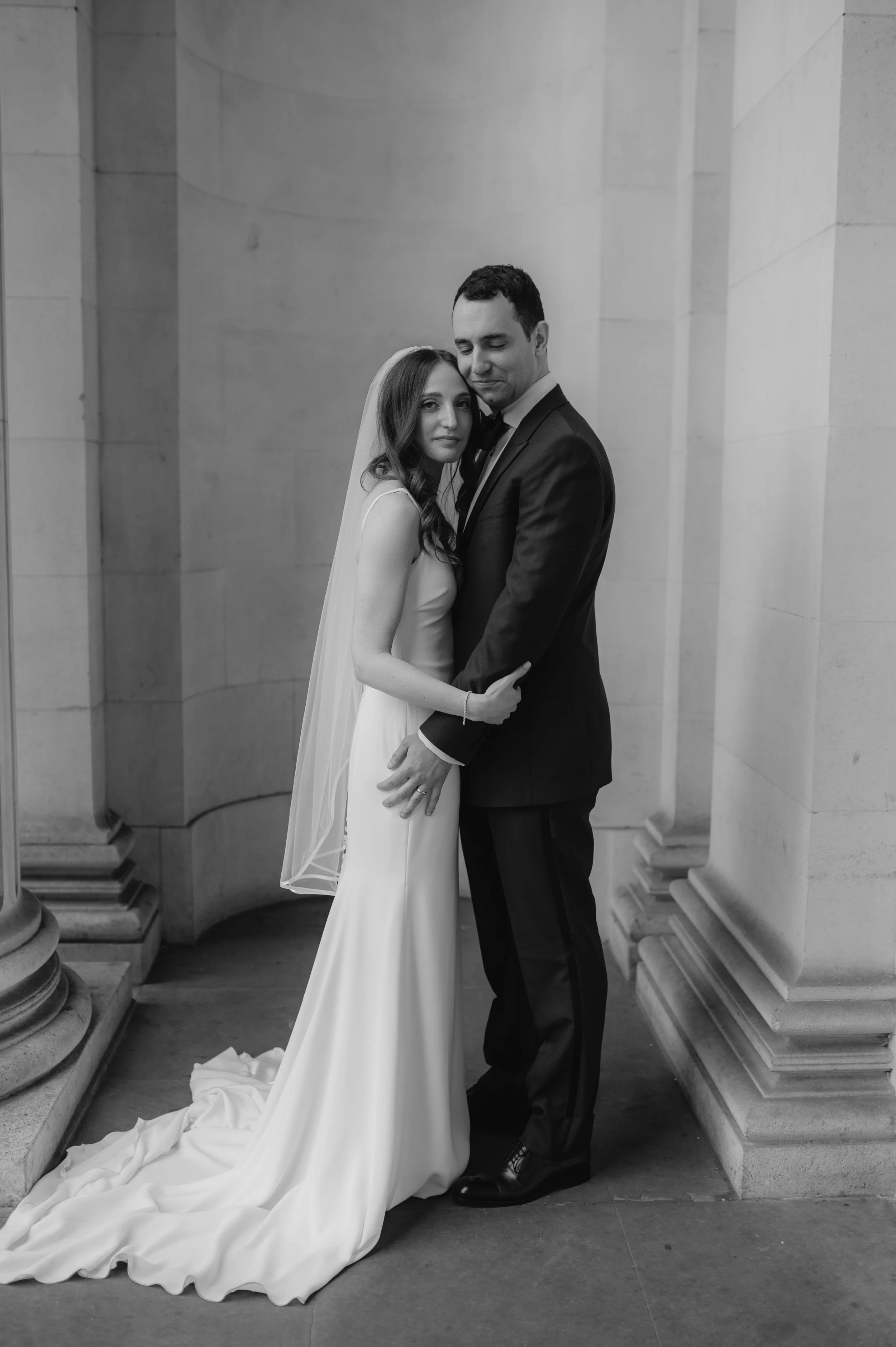 London wedding photography at Marylebone Town Hall bride and groom hugging