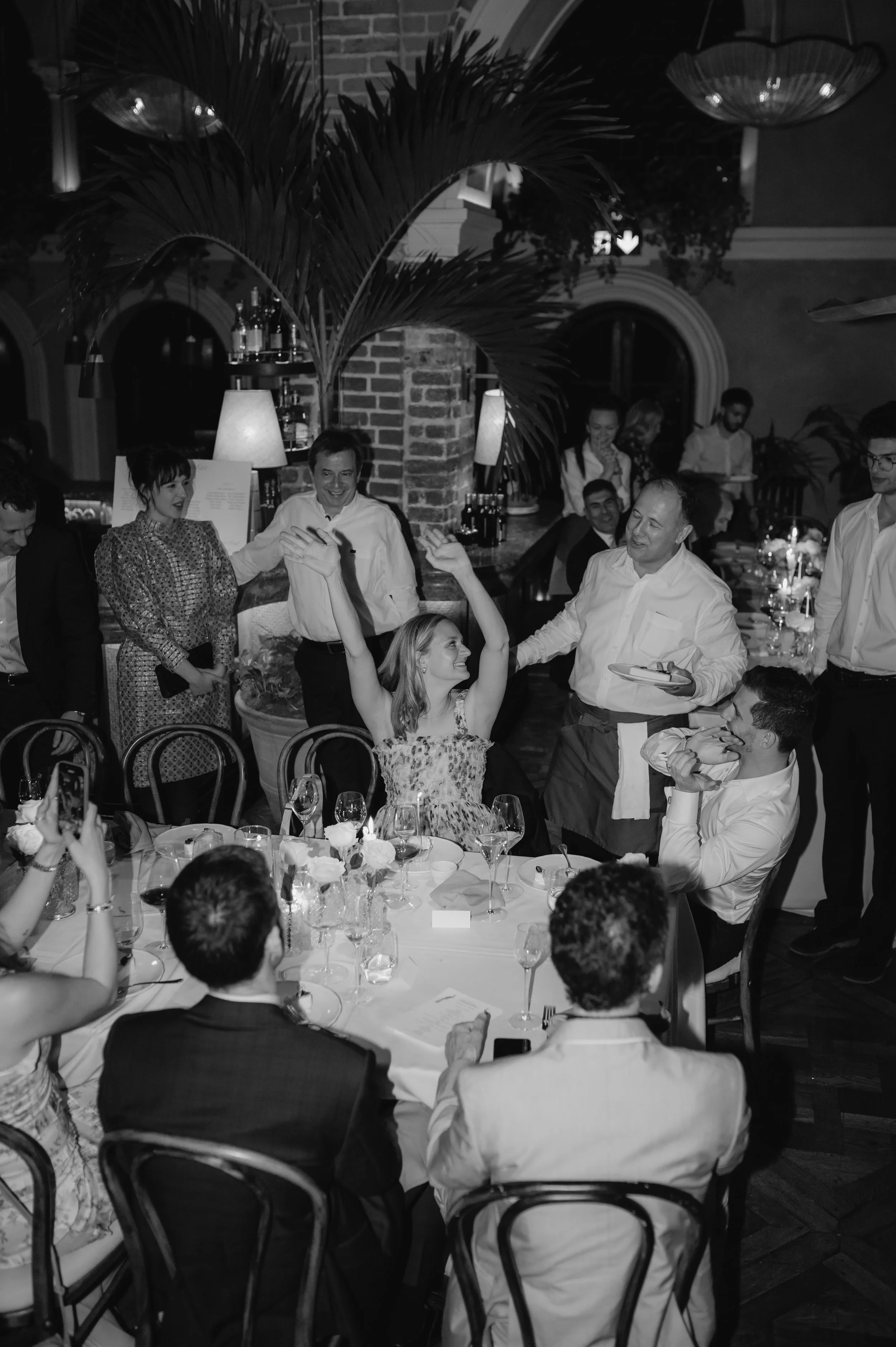 London wedding photography at Belvedere in Holland Park guests singing happy birthday to guest 