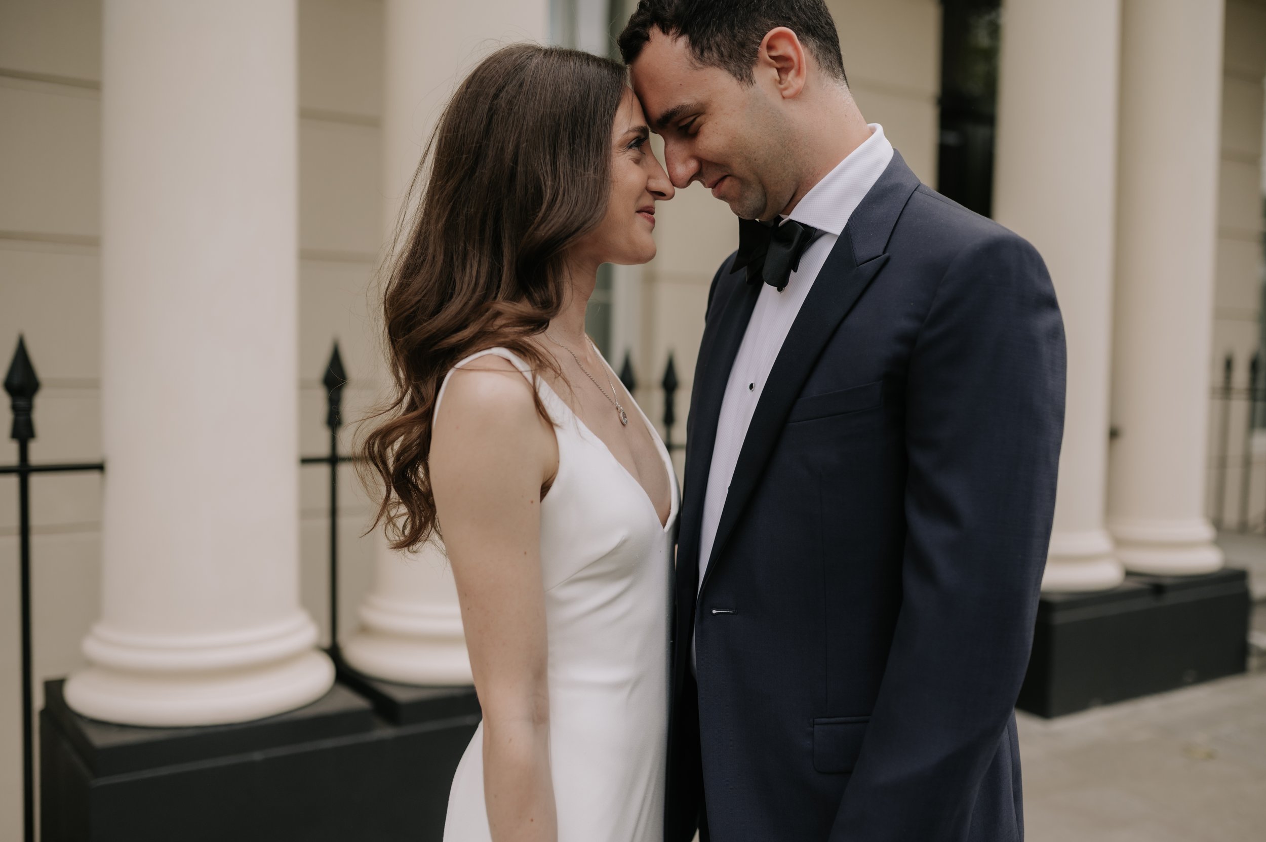 London wedding photography at Marylebone Town Hall birde and groom touching foreheads