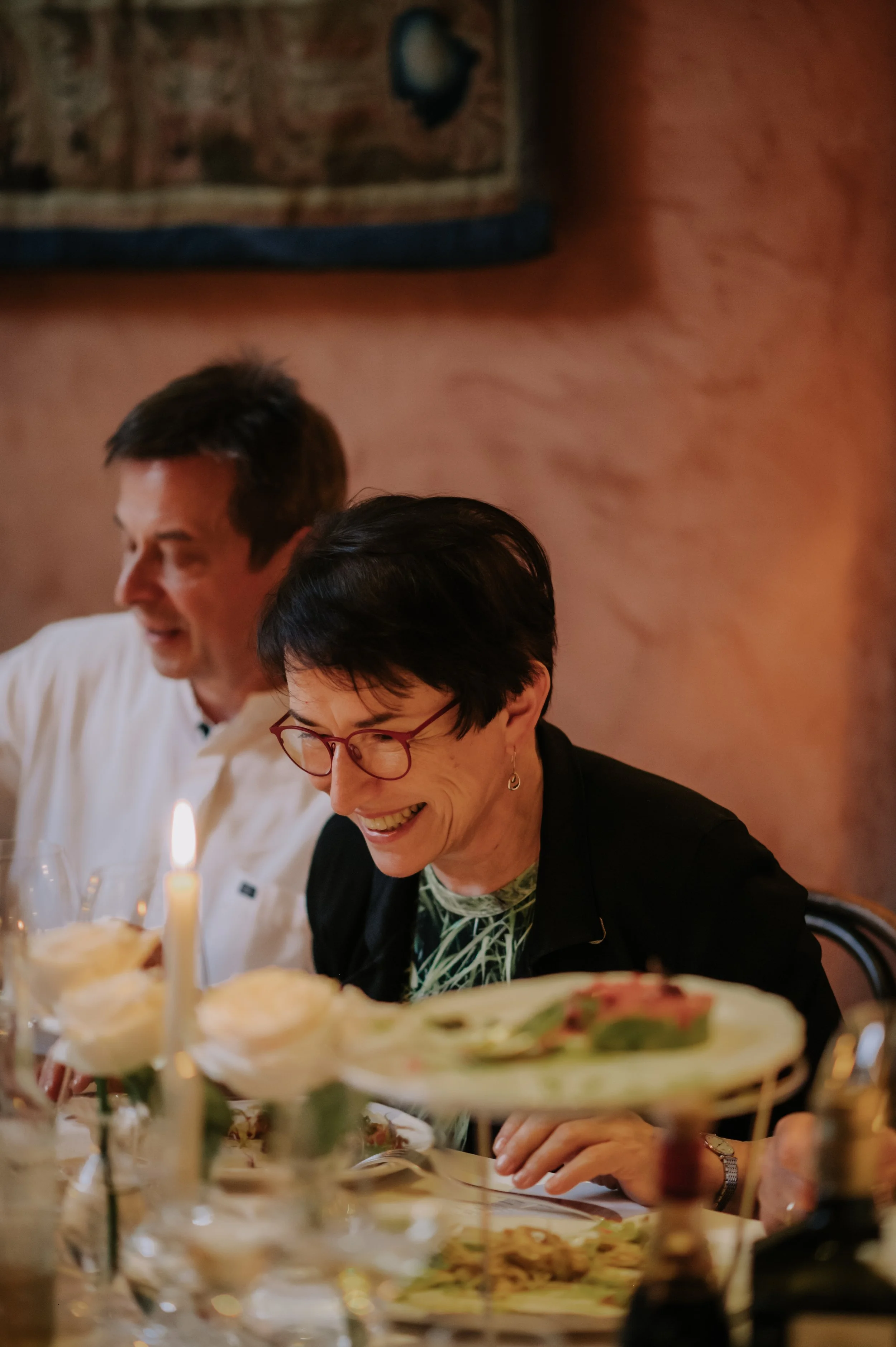 candlelit dinner London wedding photography at Belvedere in Holland Park guest laughing 