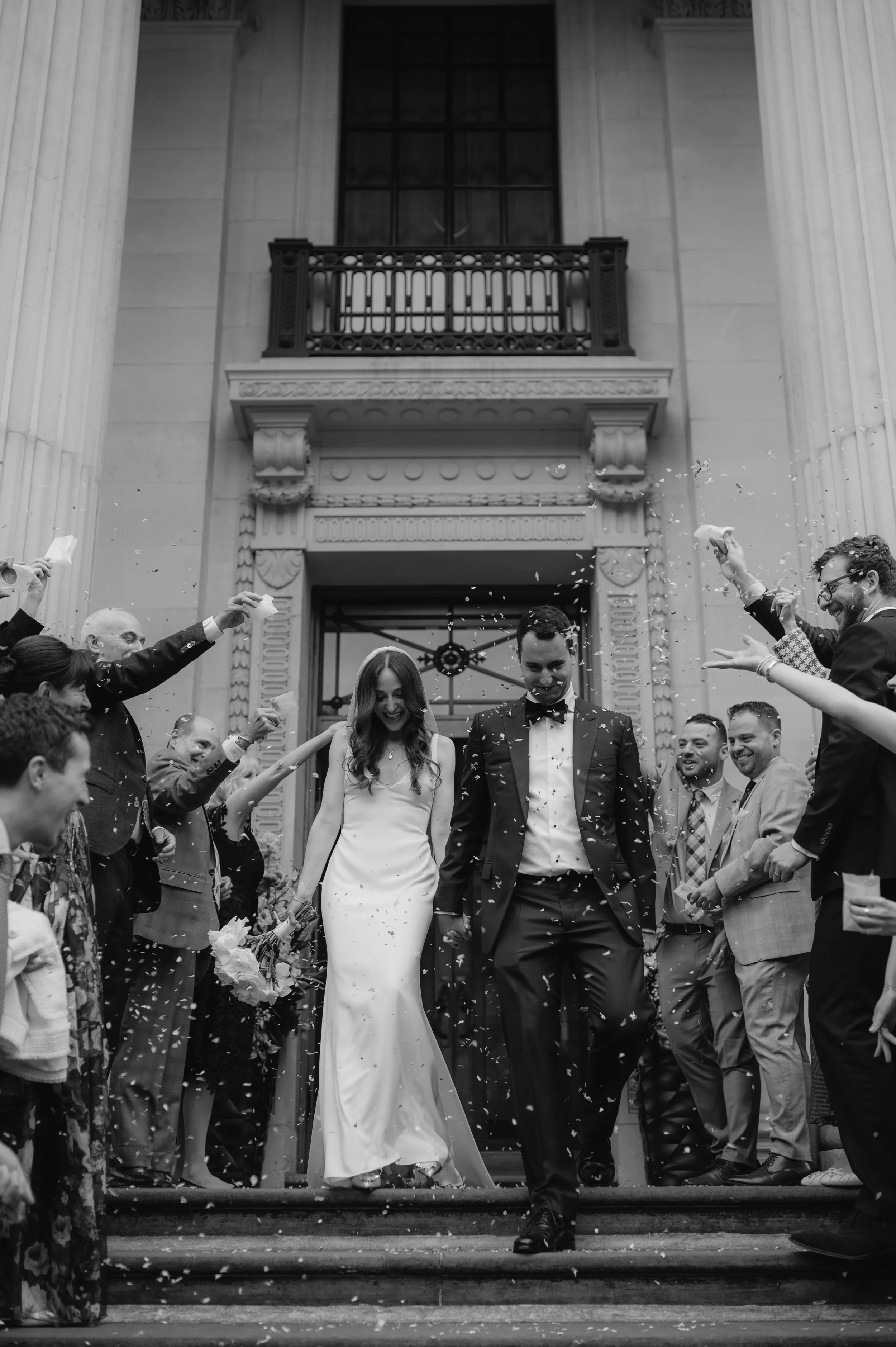 London wedding photography at Marylebone Town Hall bride and groom in confetti tunnel