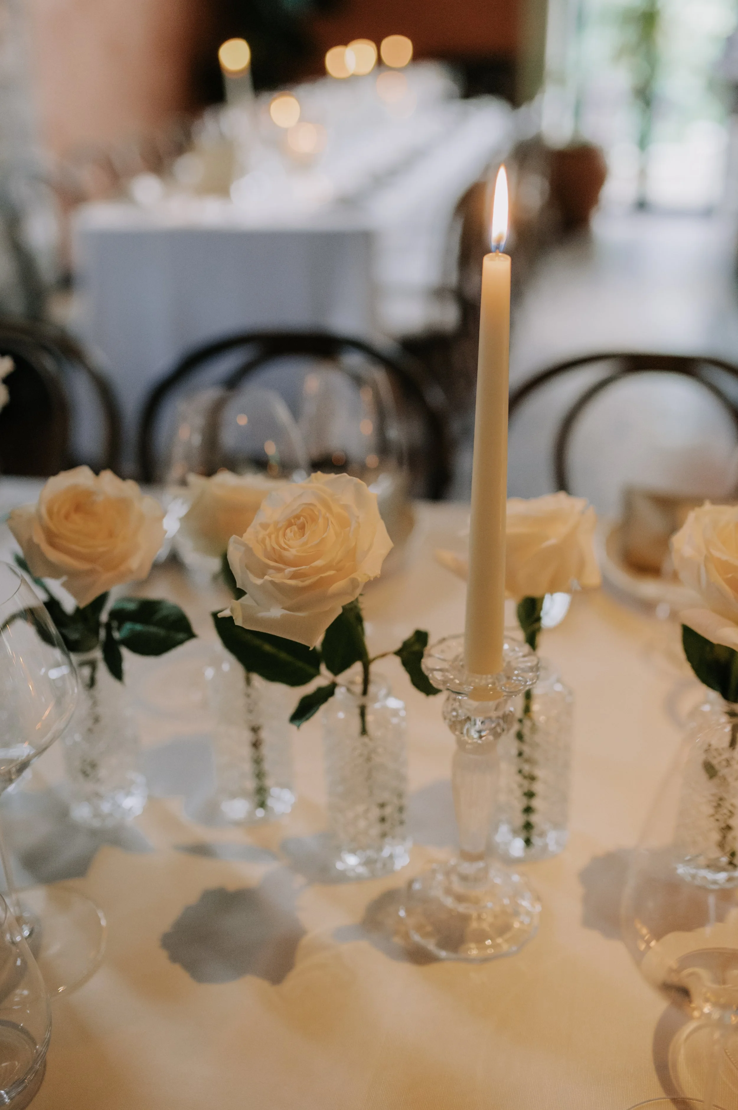 London wedding photography at Belvedere in Holland Park white roses and candles on table set up