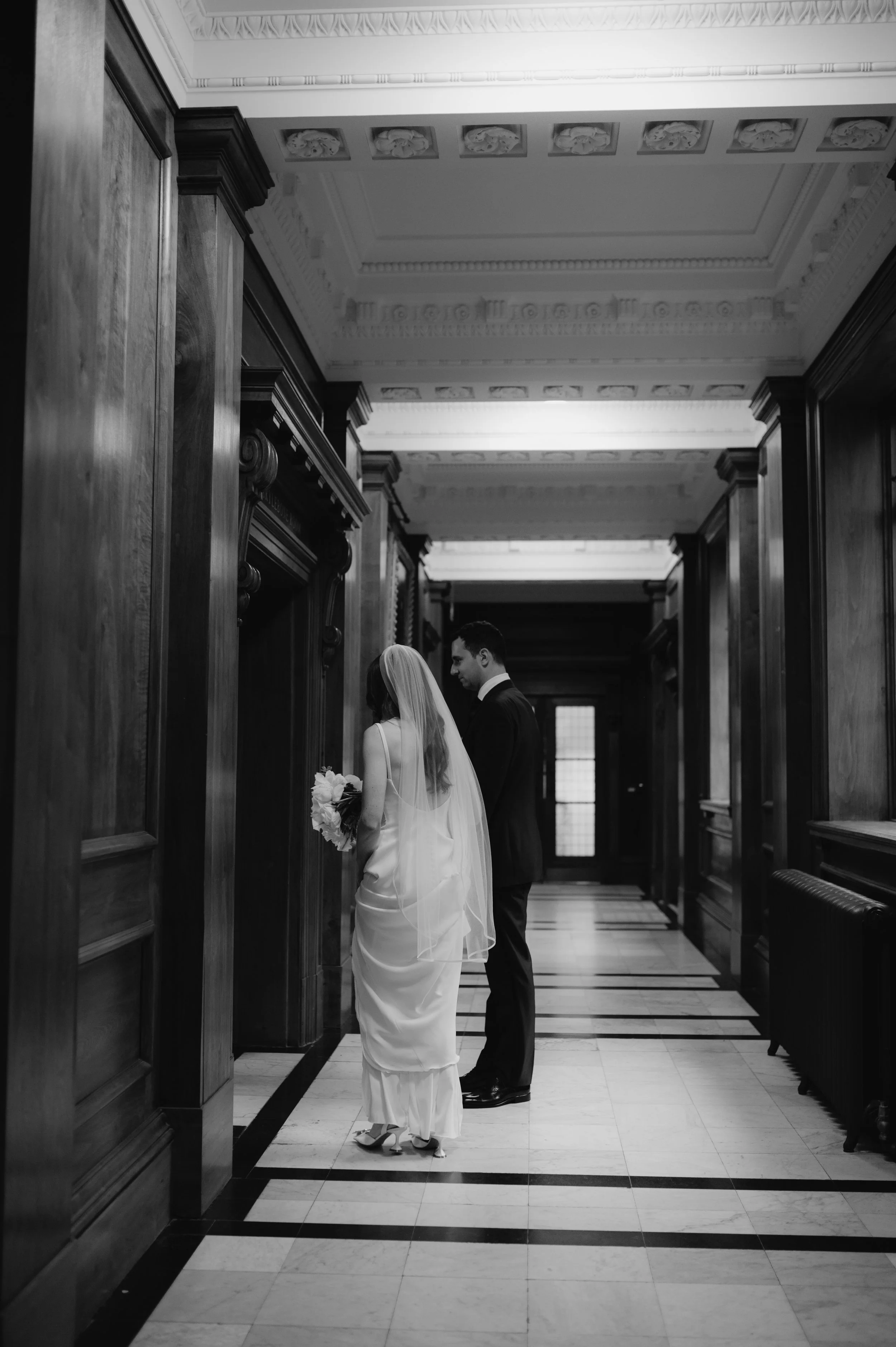 London wedding photography at Marylebone Town Hall bride and groom entering room