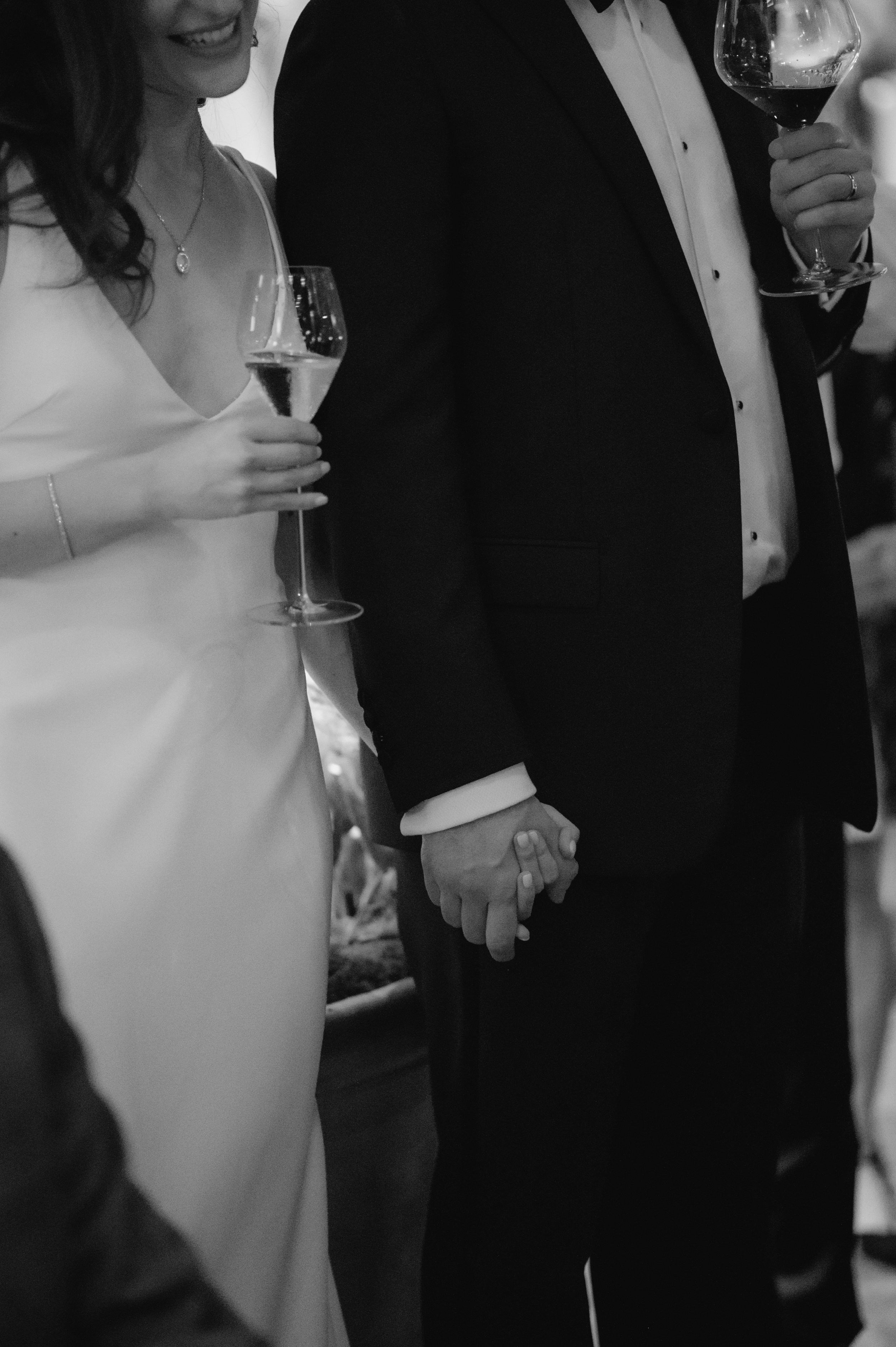candlelit dinner London wedding photography at Belvedere in Holland Park bride and groom holding hands 