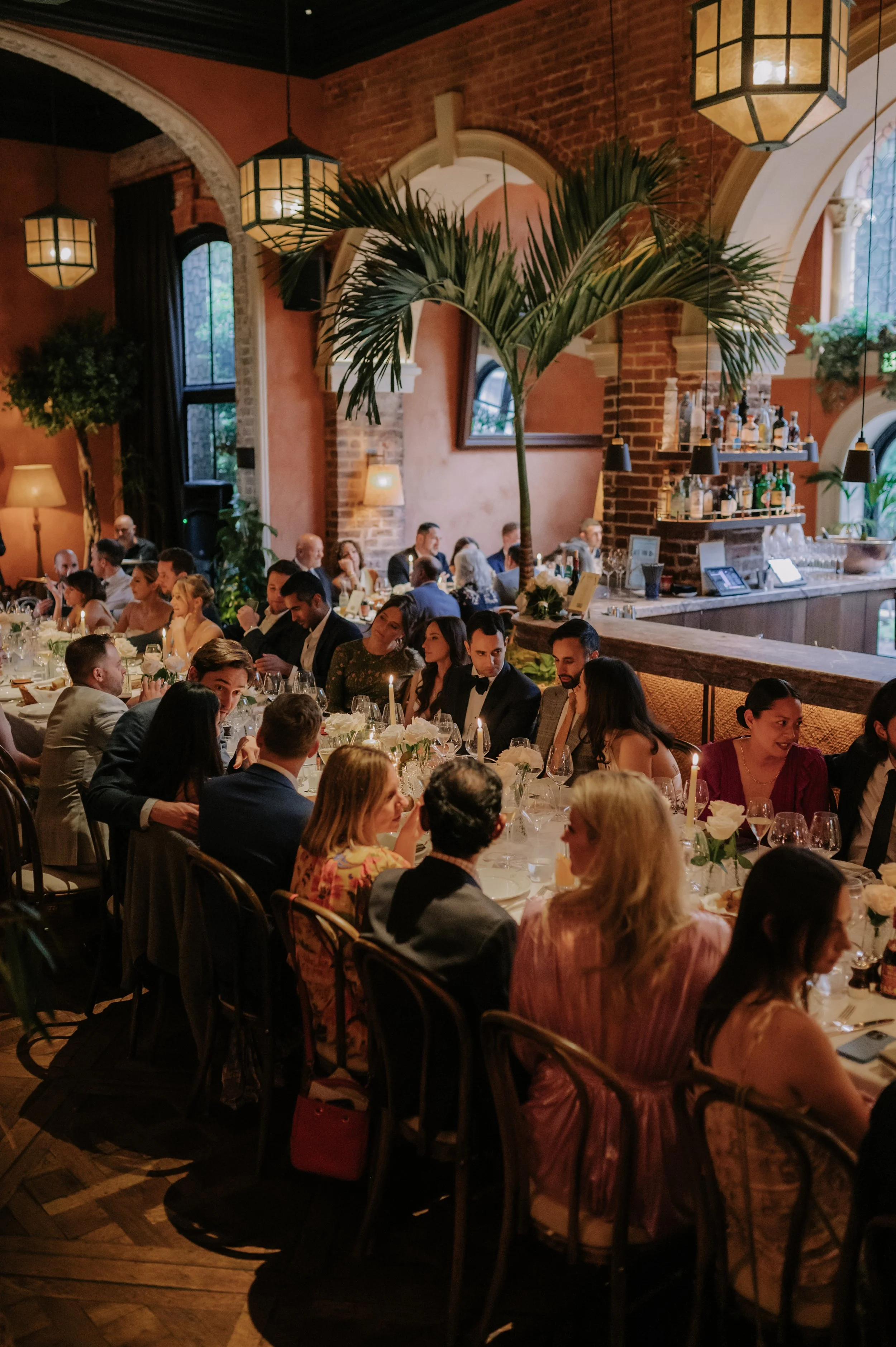 candlelit dinner London wedding photography at Belvedere in Holland Park guests sat at table 