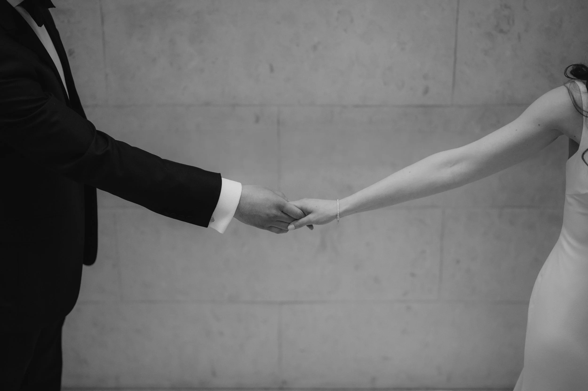 London wedding photography at Marylebone Town Hall bride and groom holding hands