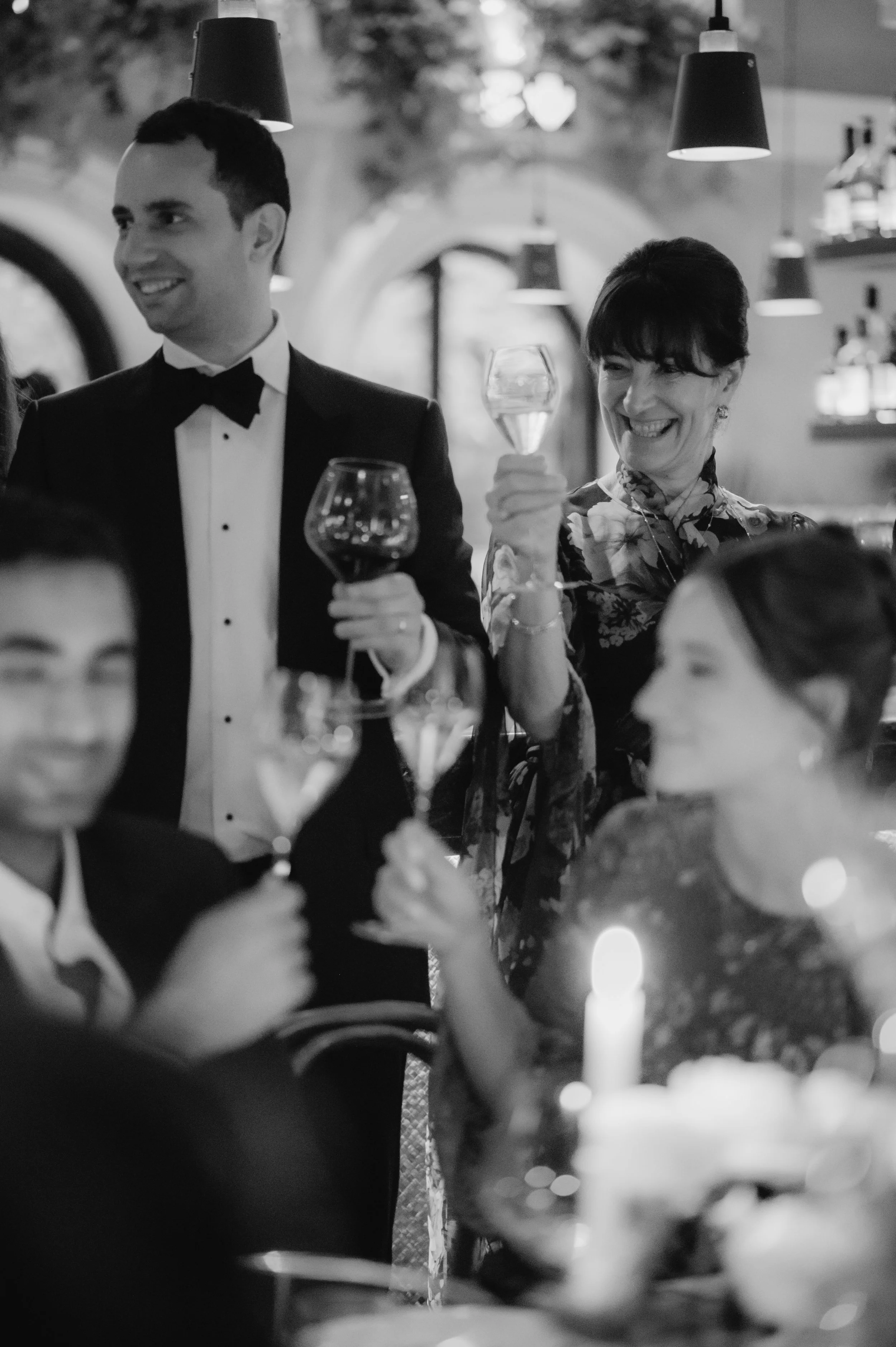 candlelit dinner London wedding photography at Belvedere in Holland Park guests clinking glasses 