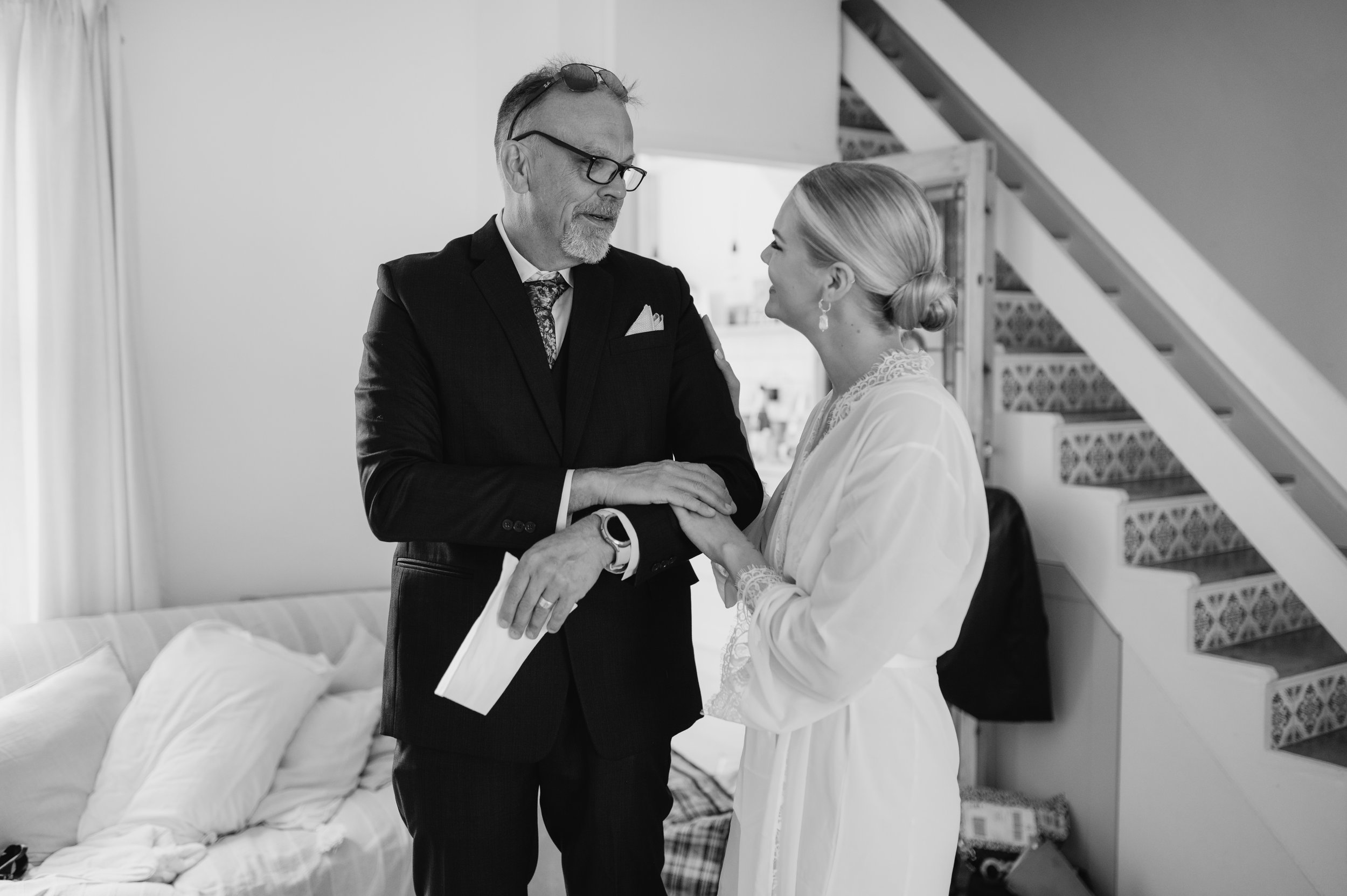 Dad sharing emotional moment with bride at Brighton wedding. Fine art documentary wedding photography. 
