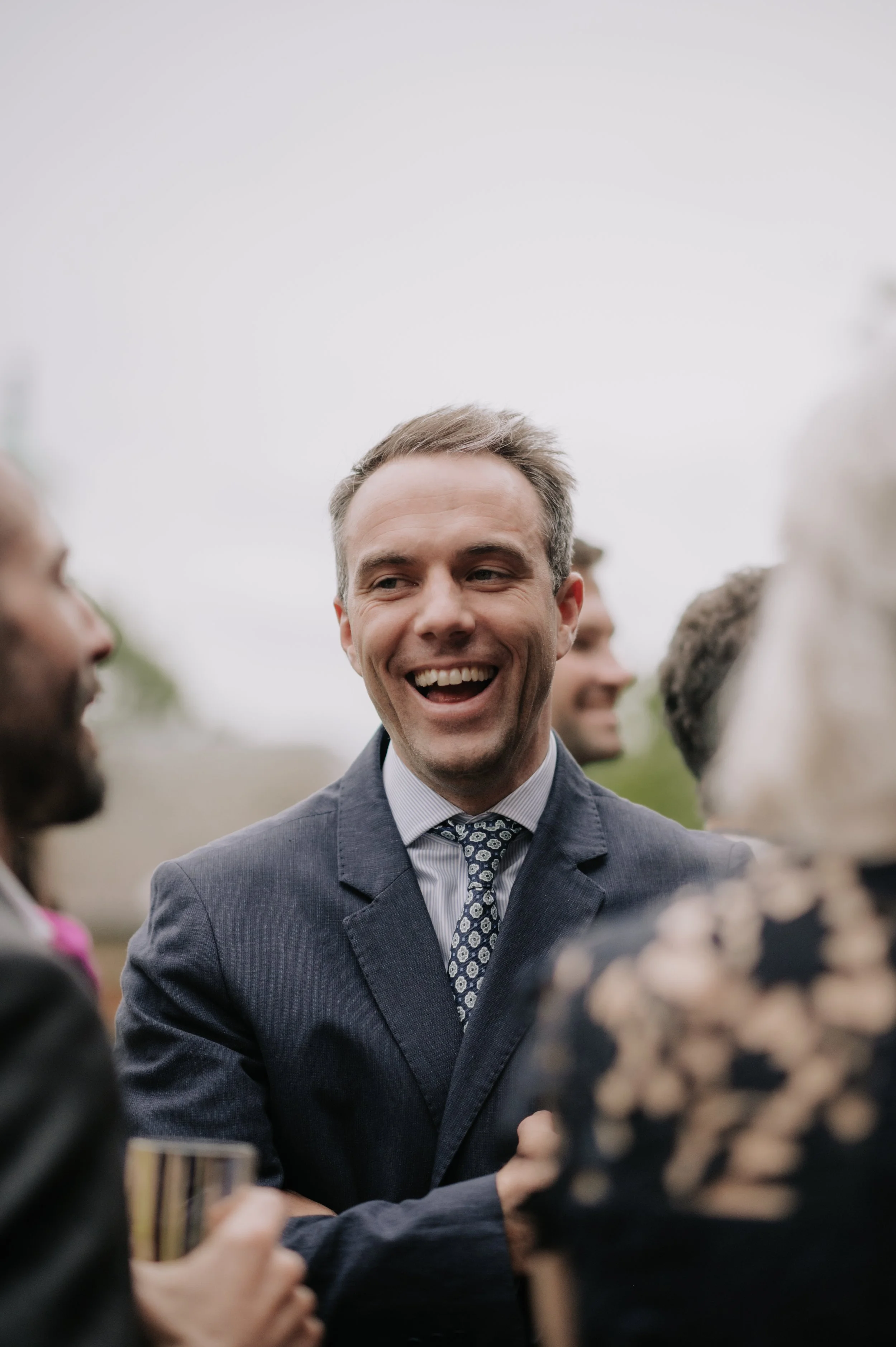 London wedding photography at Belvedere in Holland Park guests laughing 