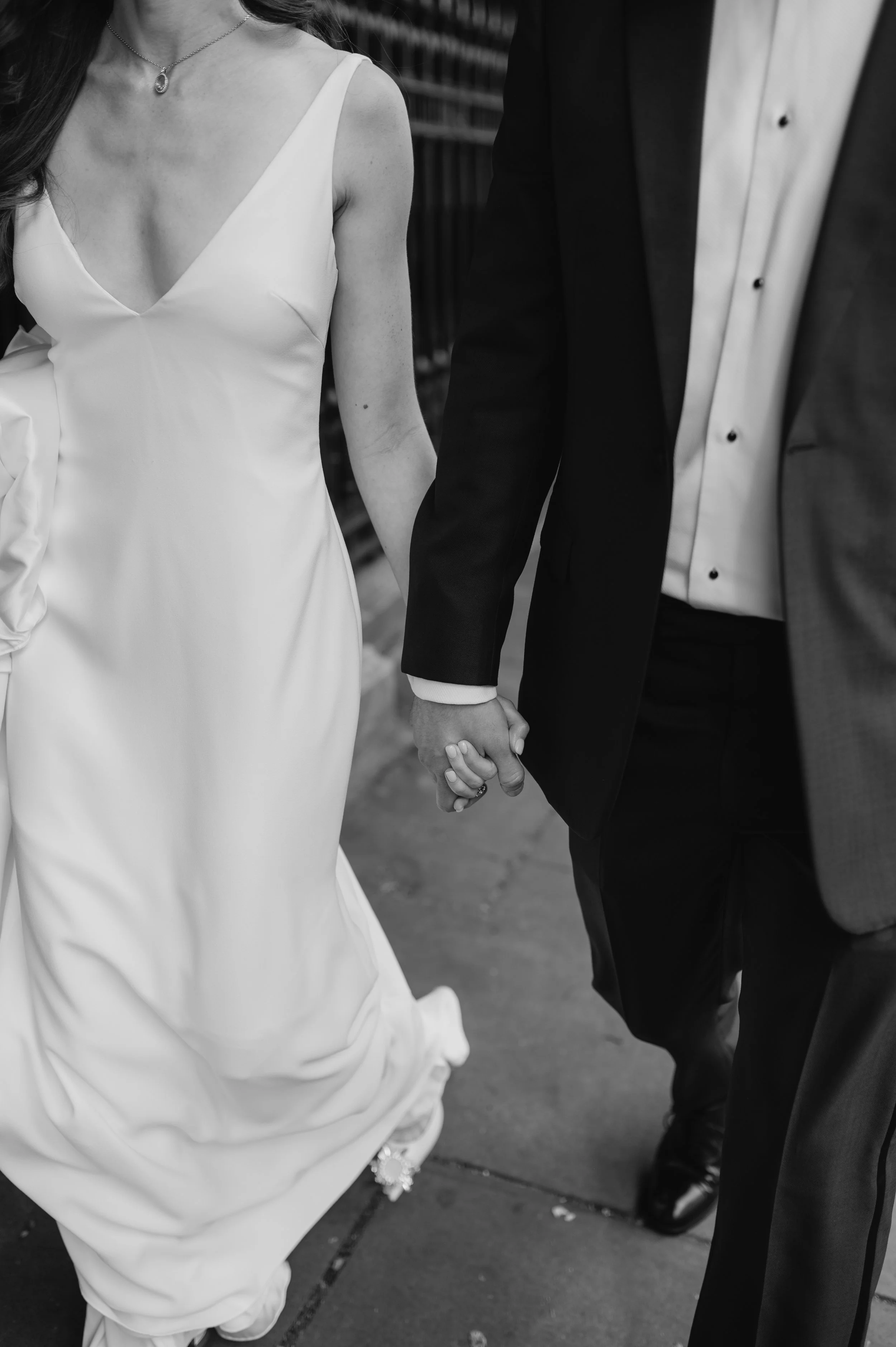 London wedding photography at Marylebone Town Hall bride and groom waling holding hands