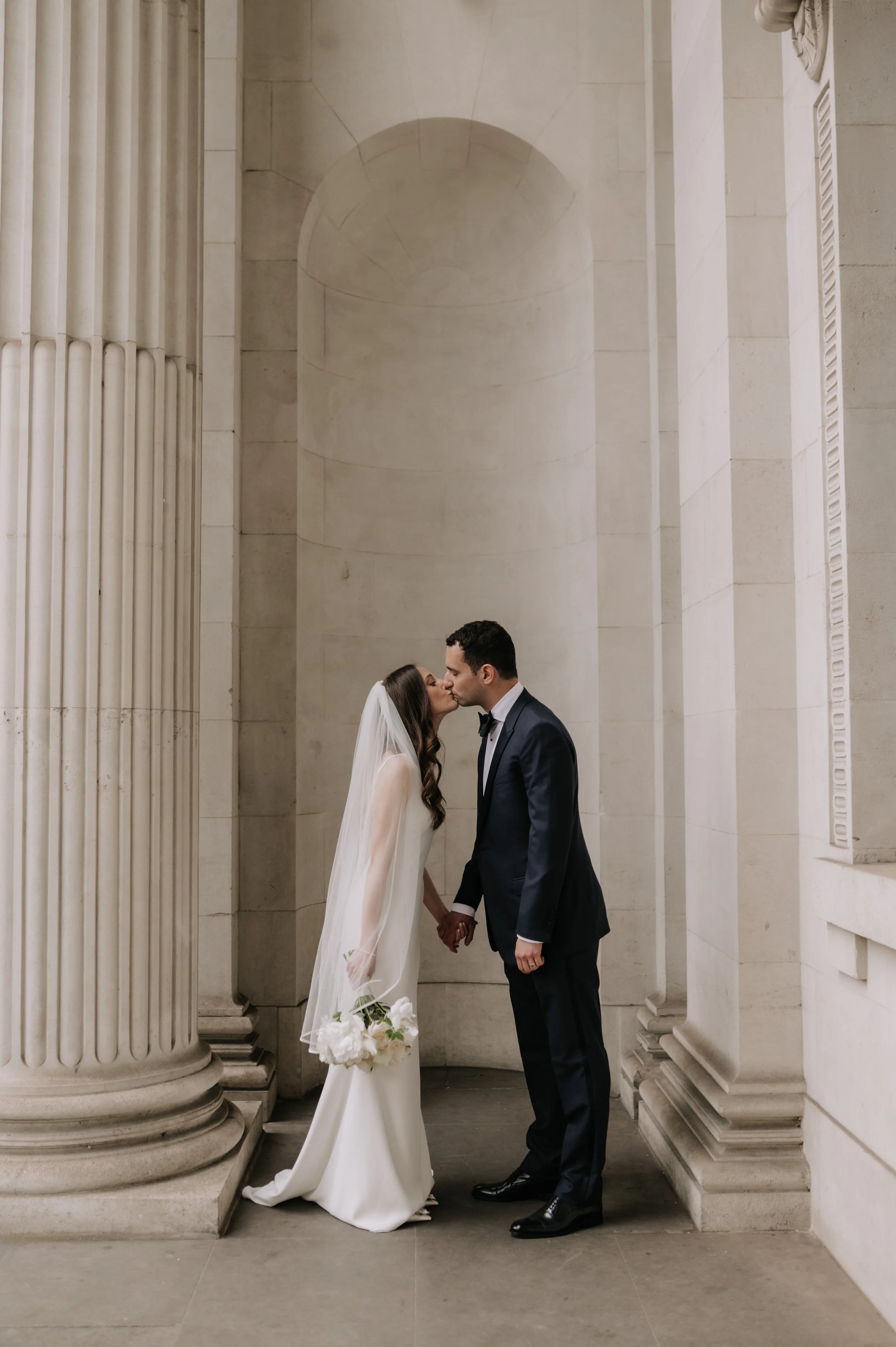 London wedding photography at Marylebone Town Hall bride and groom kissing