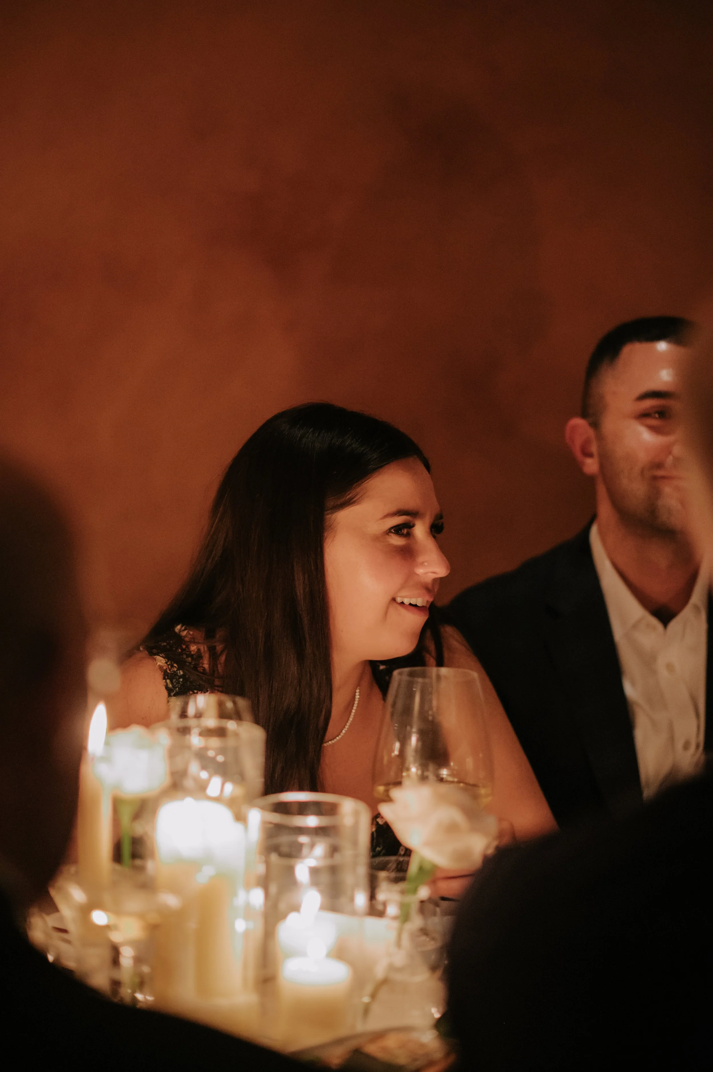 candlelit dinner London wedding photography at Belvedere in Holland Park guest smiling 