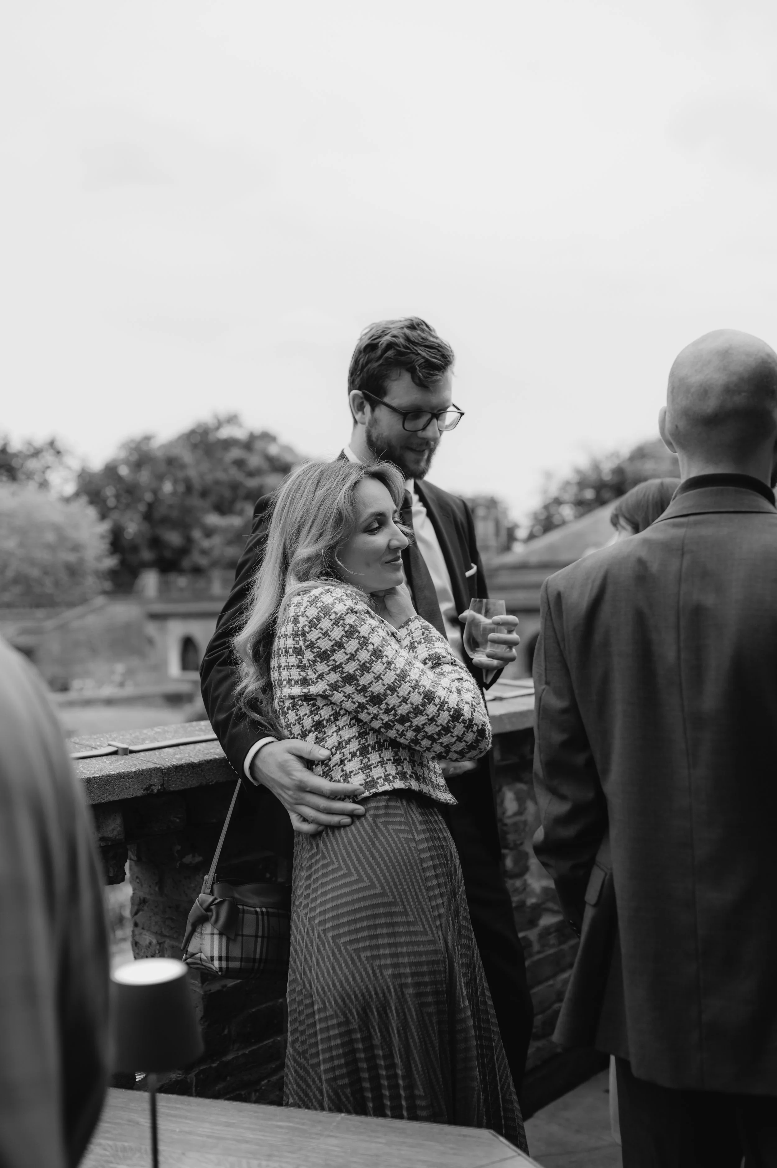 London wedding photography at Belvedere in Holland Park guests hugging