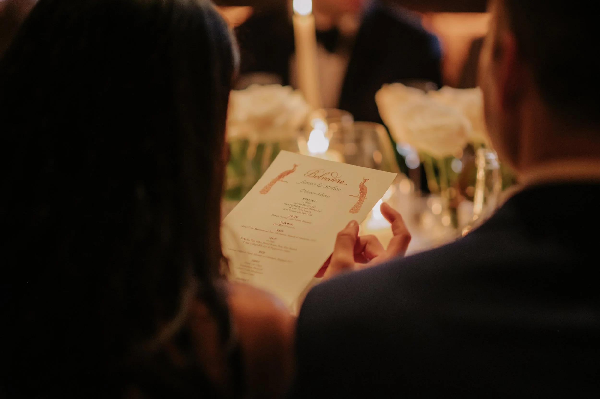 candlelit dinner London wedding photography at Belvedere in Holland Park guest reading menu 