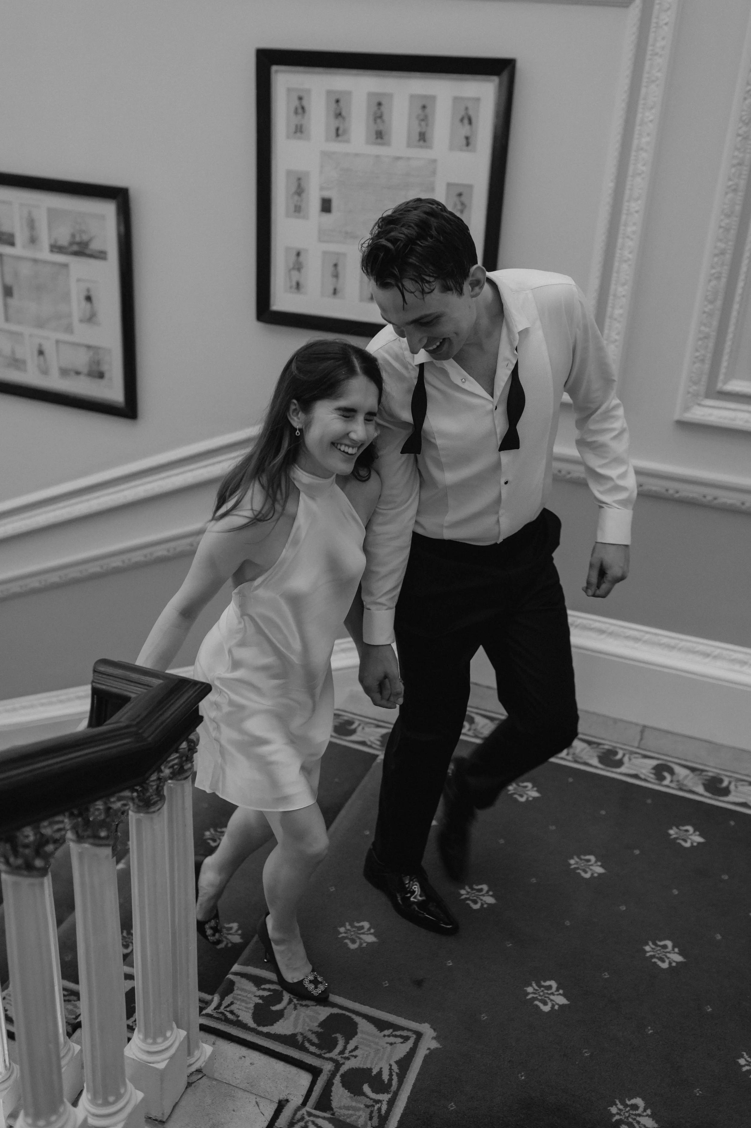bride and groom walk up the stairs at London wedding