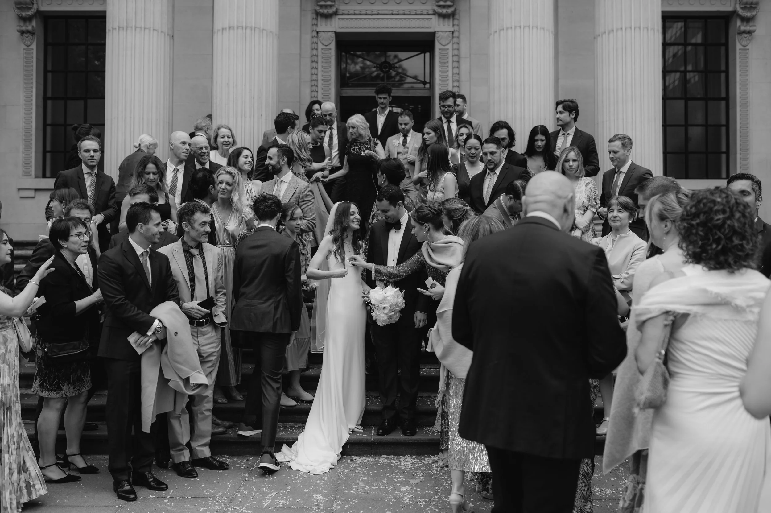 London wedding photography at Marylebone Town Hall guests standing on steps