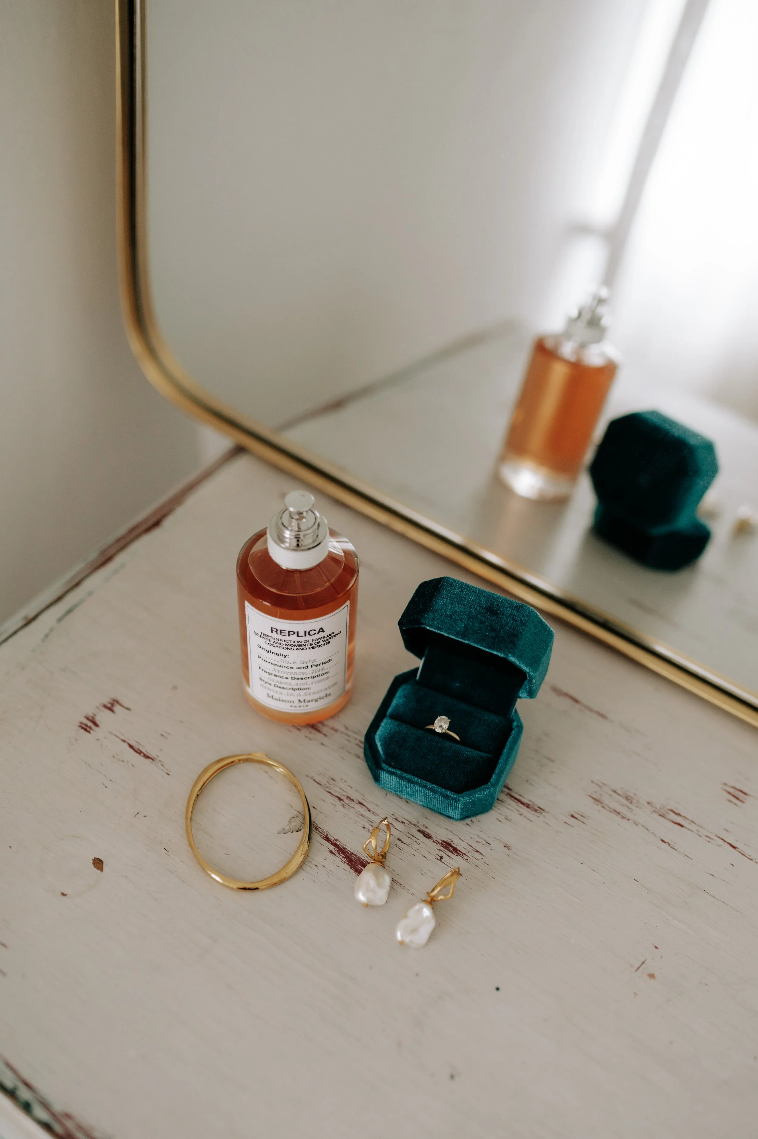 Jewellery and perfume at Brighton wedding. Fine art documentary wedding photography. 