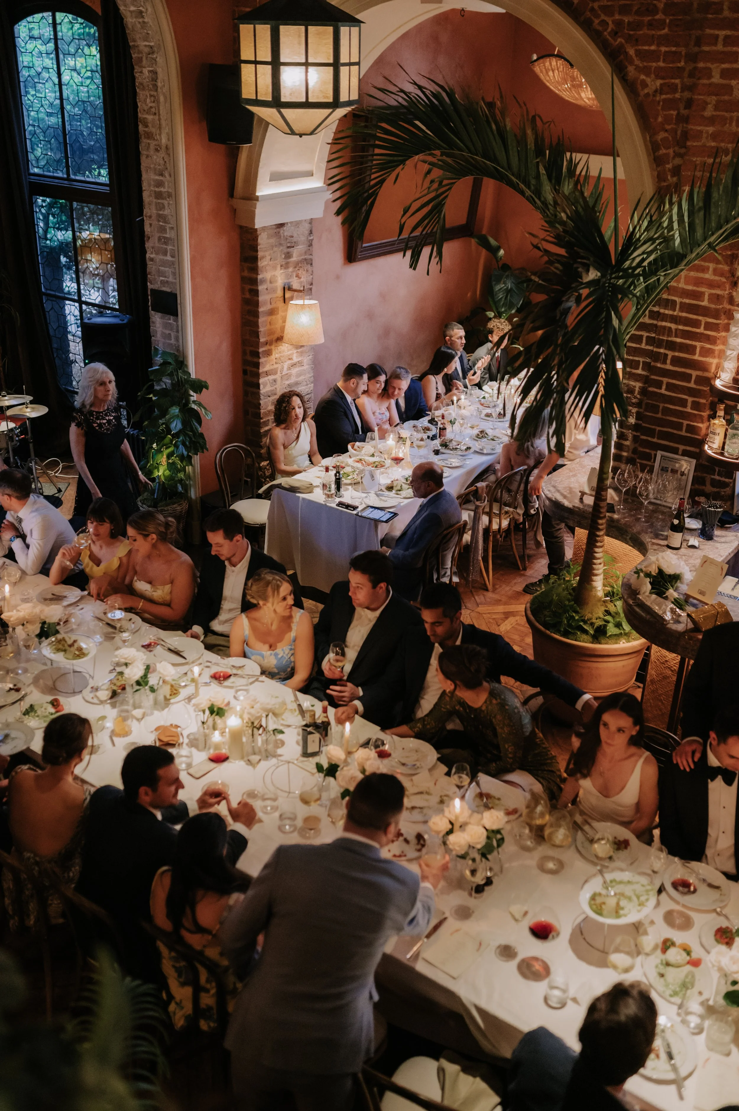 candlelit dinner London wedding photography at Belvedere in Holland Park guests sat at table 