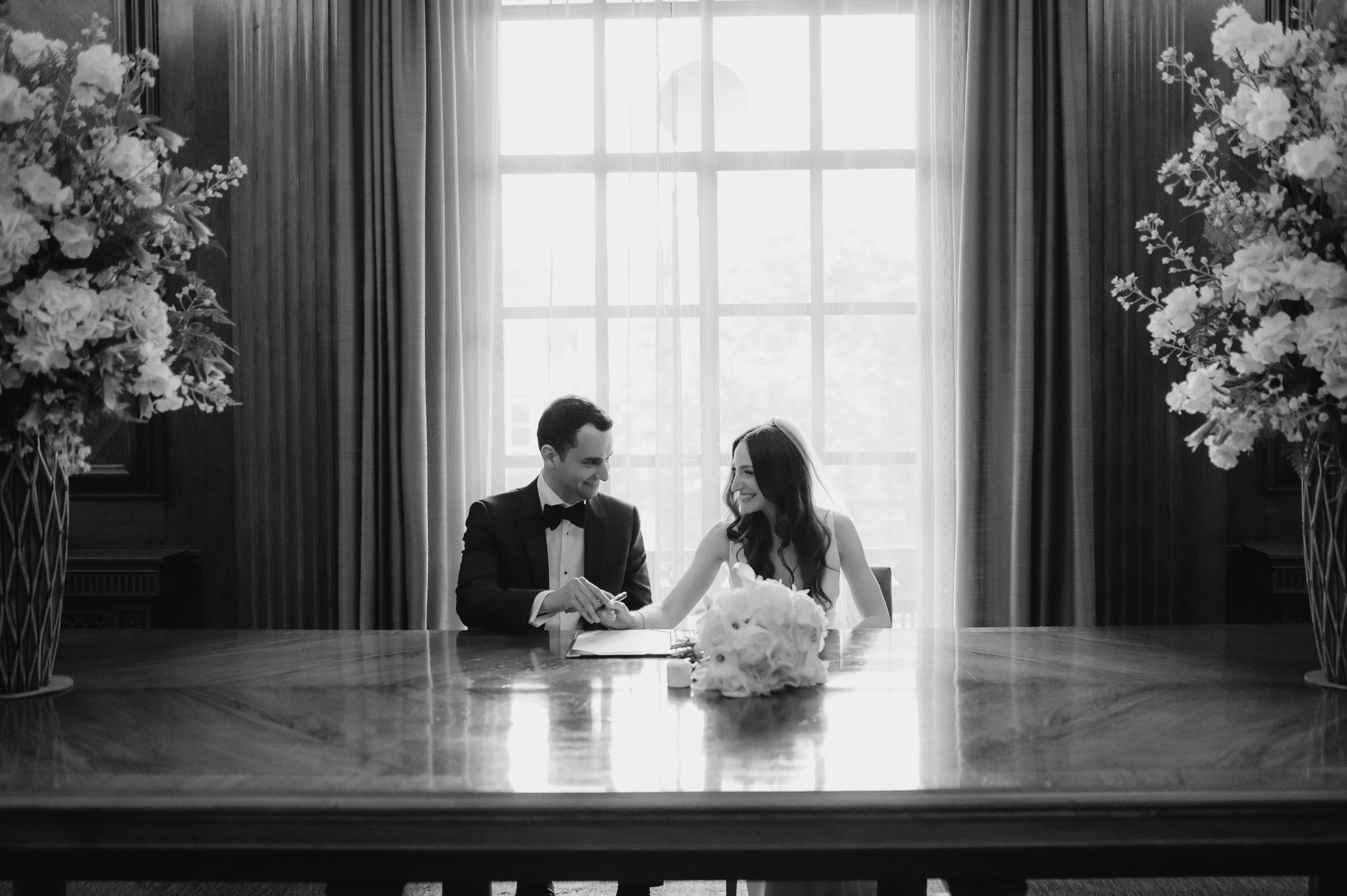 London wedding photography at Marylebone Town Hall bride and groom signing registry 