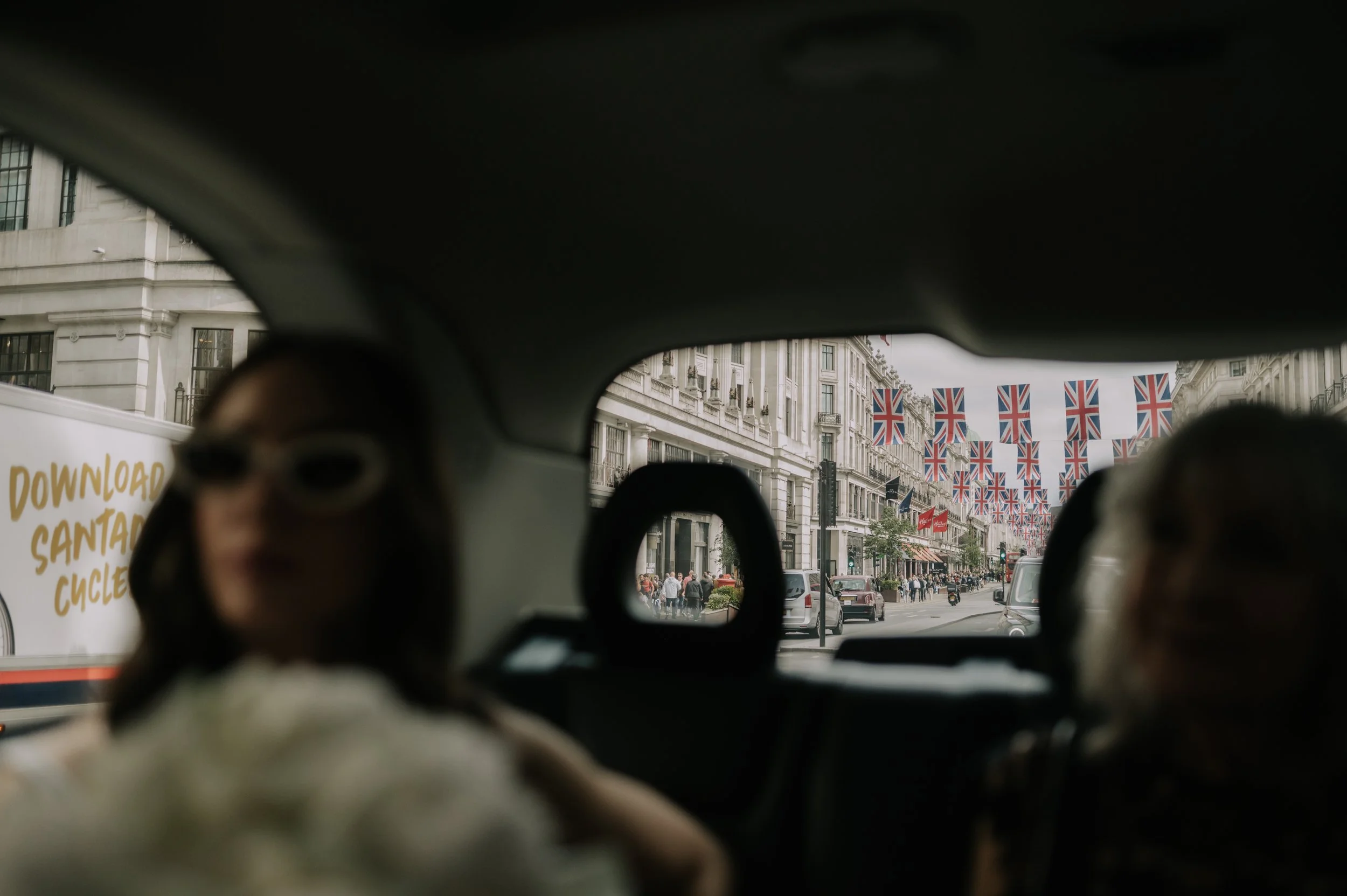 London wedding photography at Marylebone Town Hall in taxi