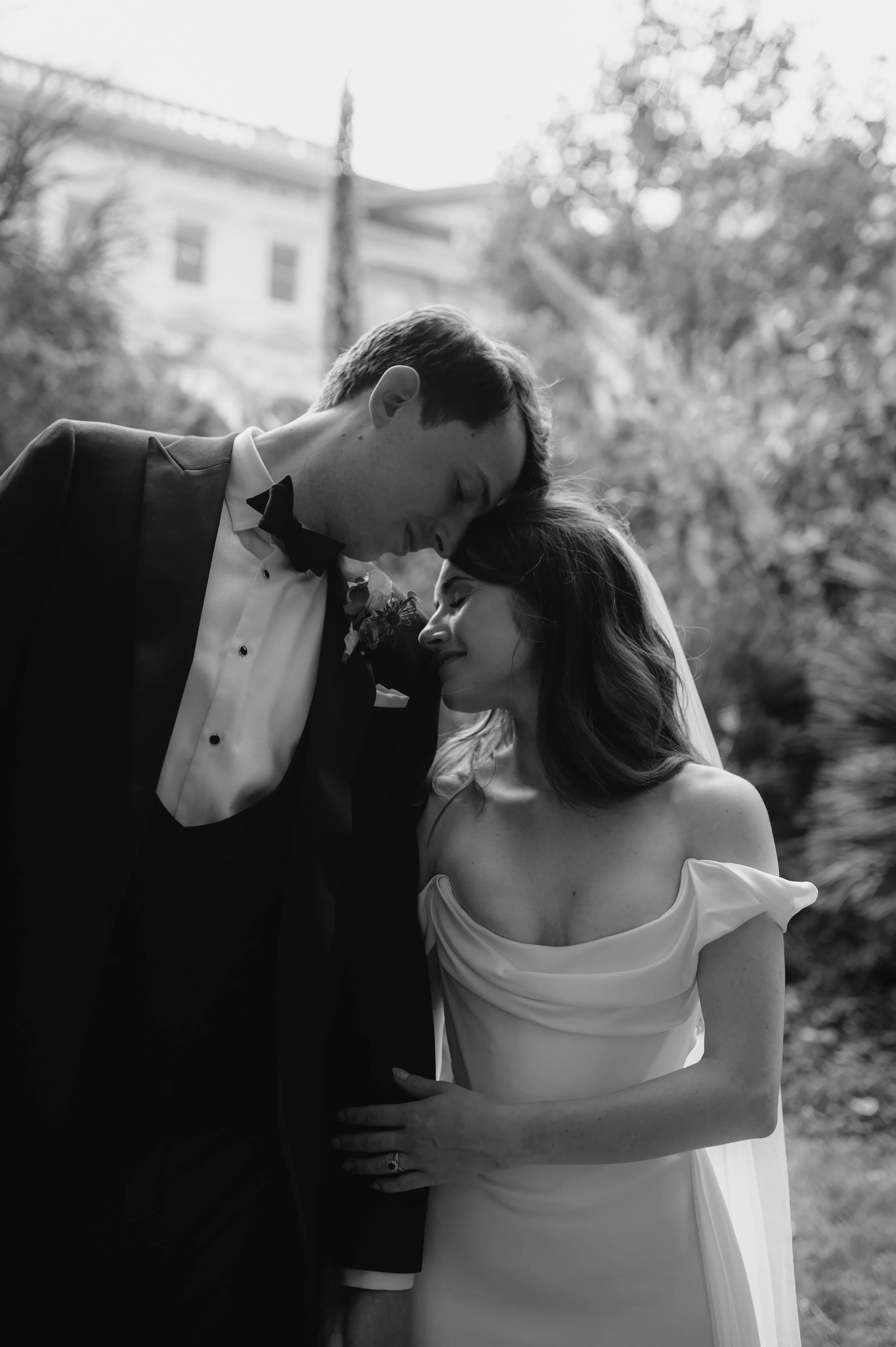 bride and groom rest foreheads together with eyes closed at London wedding