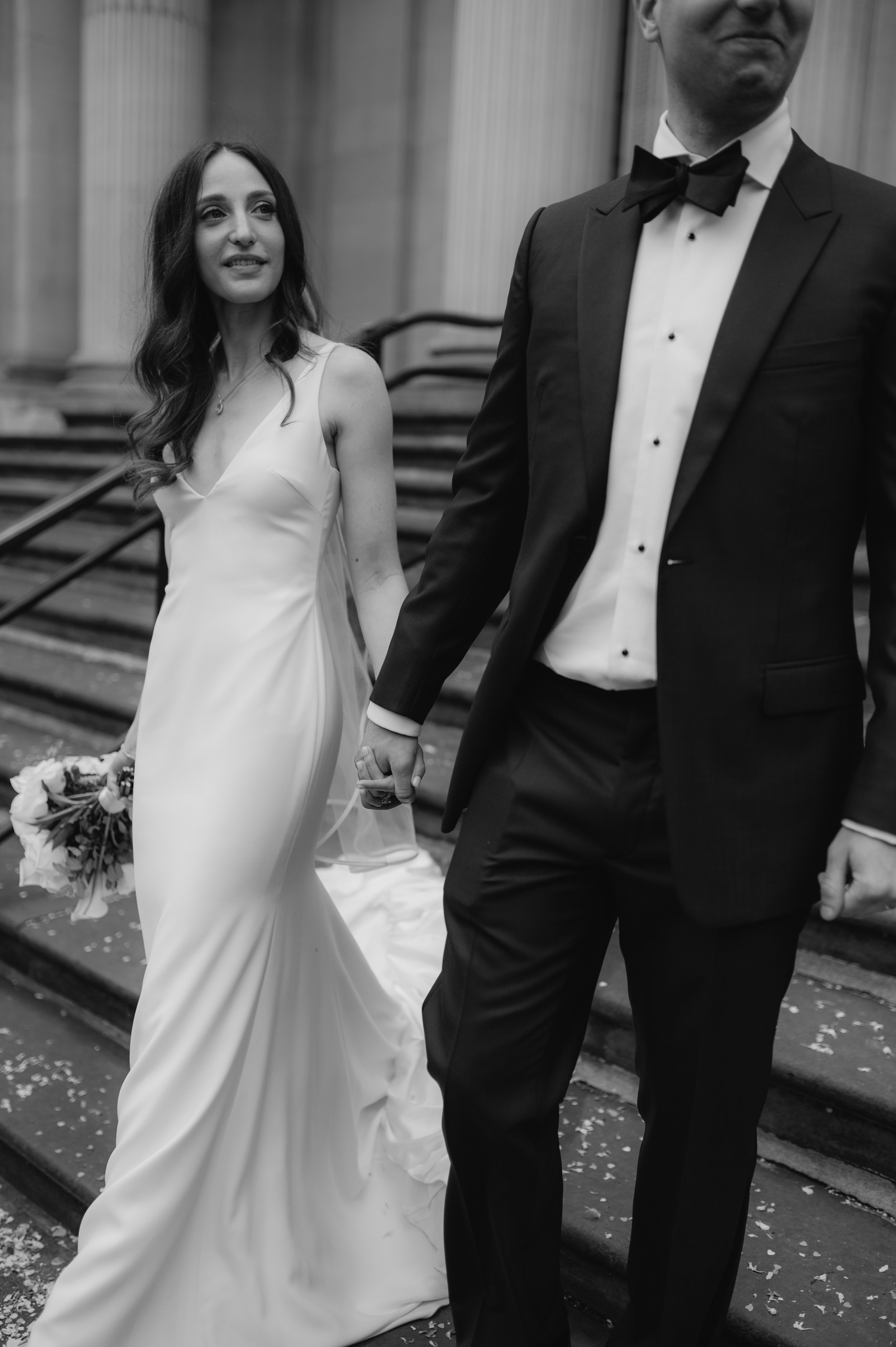 London wedding photography at Marylebone Town Hall bride and groom walking down steps 