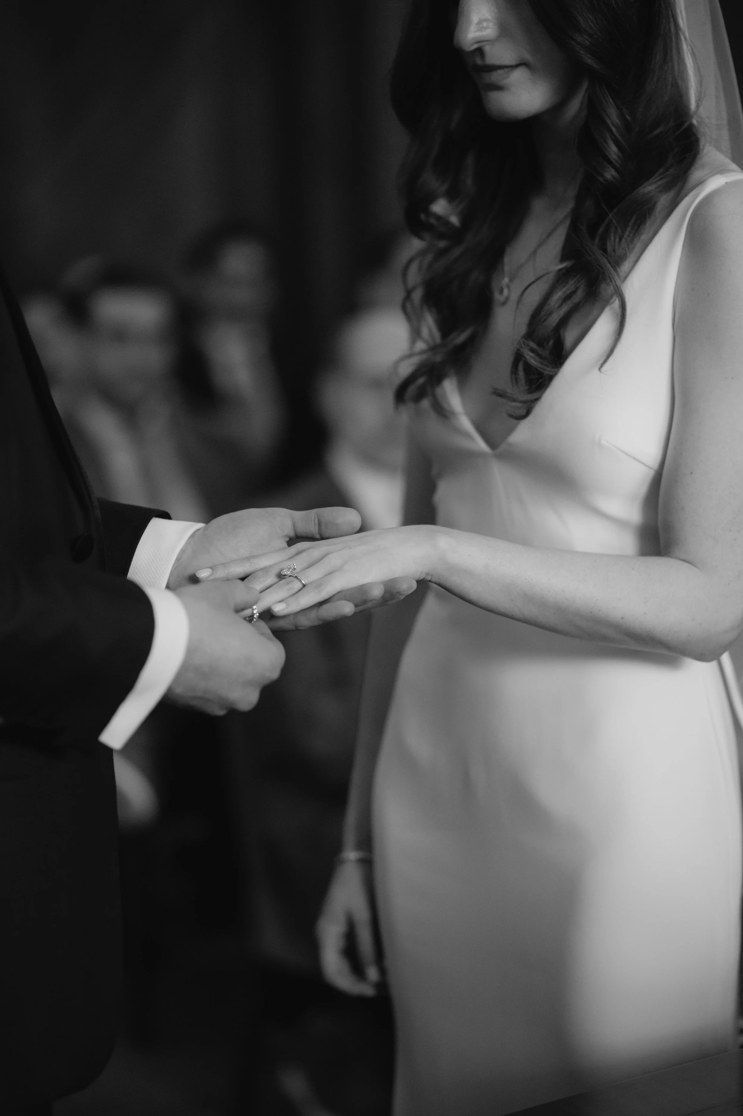 London wedding photography at Marylebone Town Hall groom placing ring on brides hand