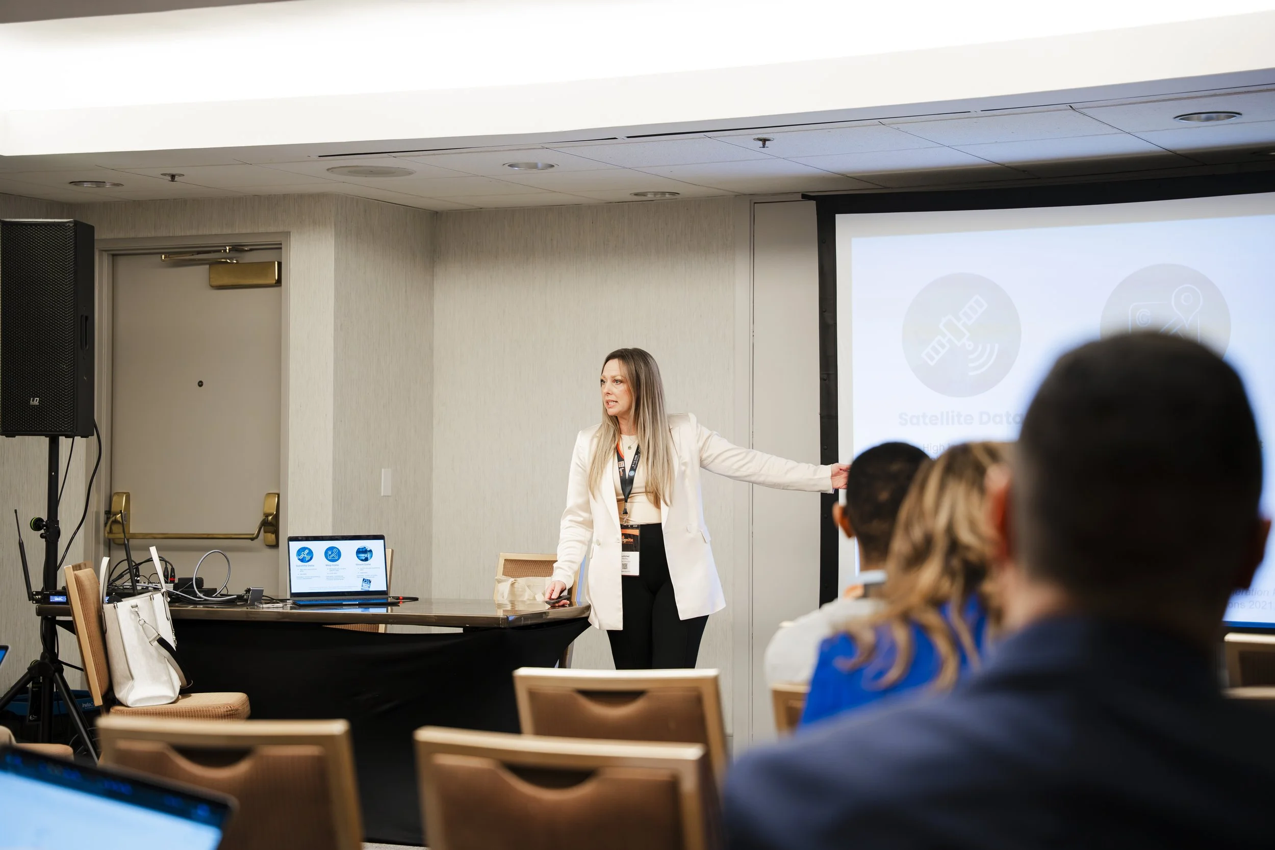 woman presenting at conference