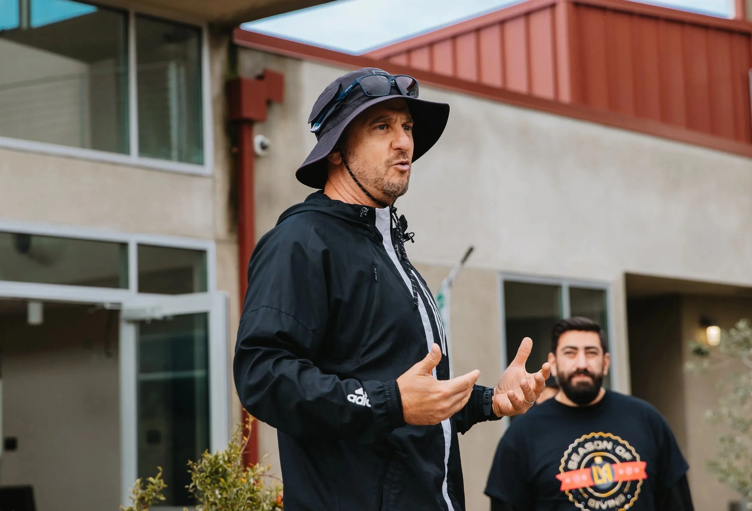 b goodly founder Aron Levinson addresses a group of corporate volunteers at Mudtown farms in Watts, California