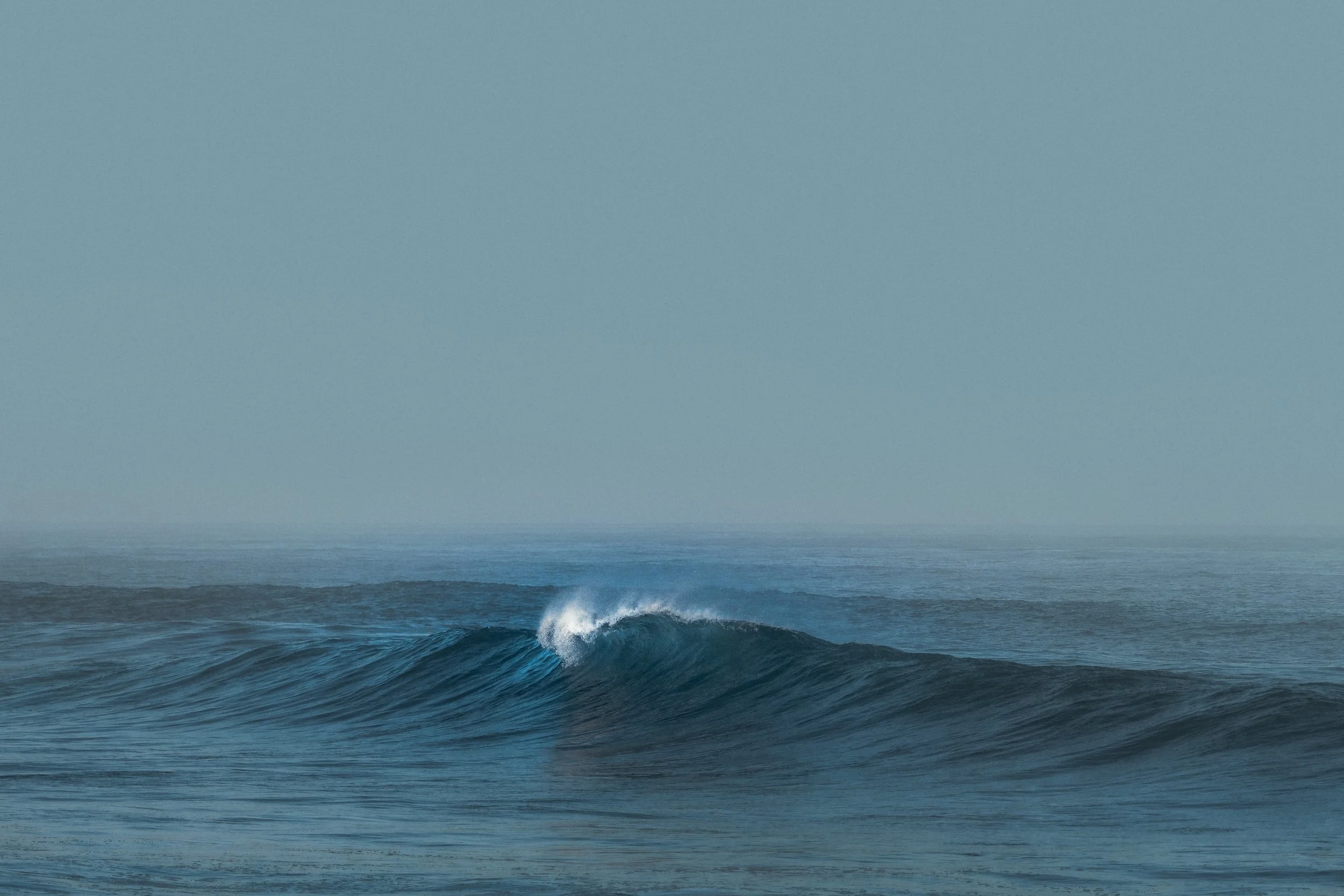 Ocean waves with a mist spray.