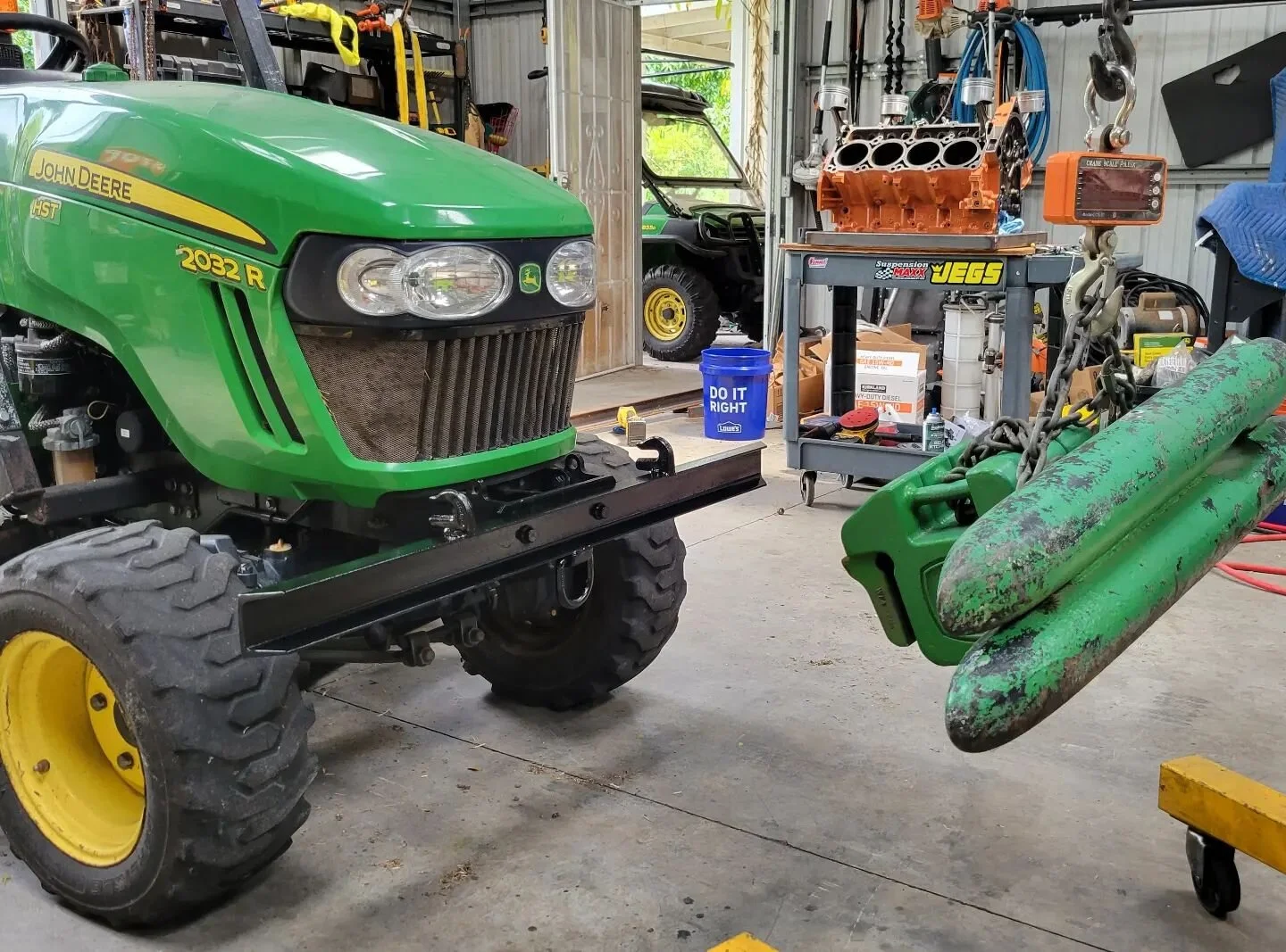 A few tractor upgrades. The small tractor doesn't need the large counterweight anymore, so I built a custom multi function bumper. Also made a mower exit chute rubber guard out of a mud flap. #johndeeretractor #johndeere #2032r #farmequipment #farmli
