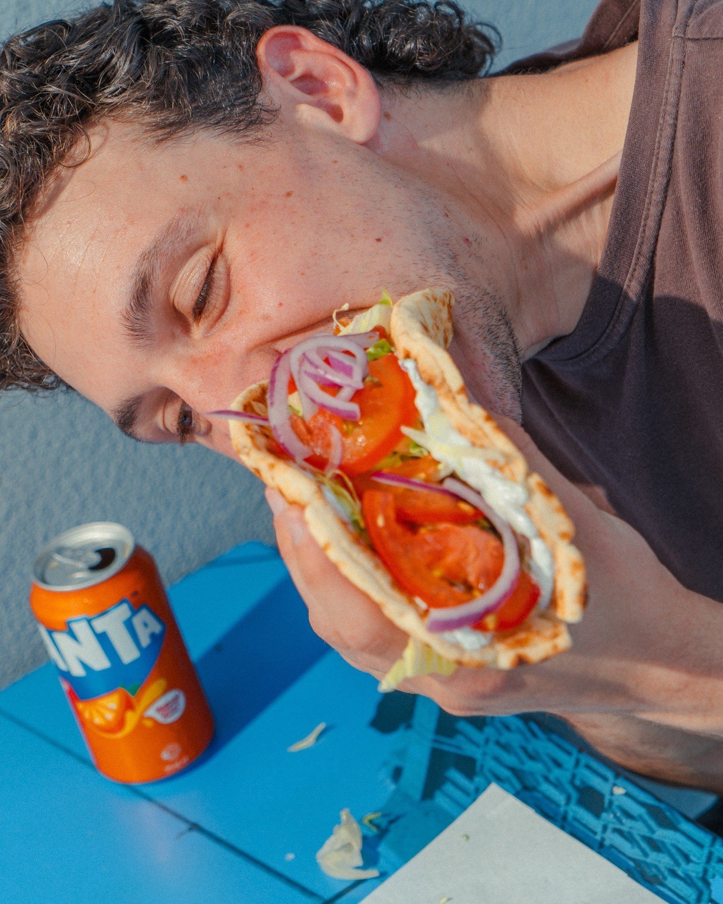 Wow, he looks like he's really enjoying that... Do you have a friend addicted to souvlaki? Bring them down to Shark Tank Seafood for the best fish and chips on this side of town.⁠
⁠
A Fanta to wash it down, of course. 🍊