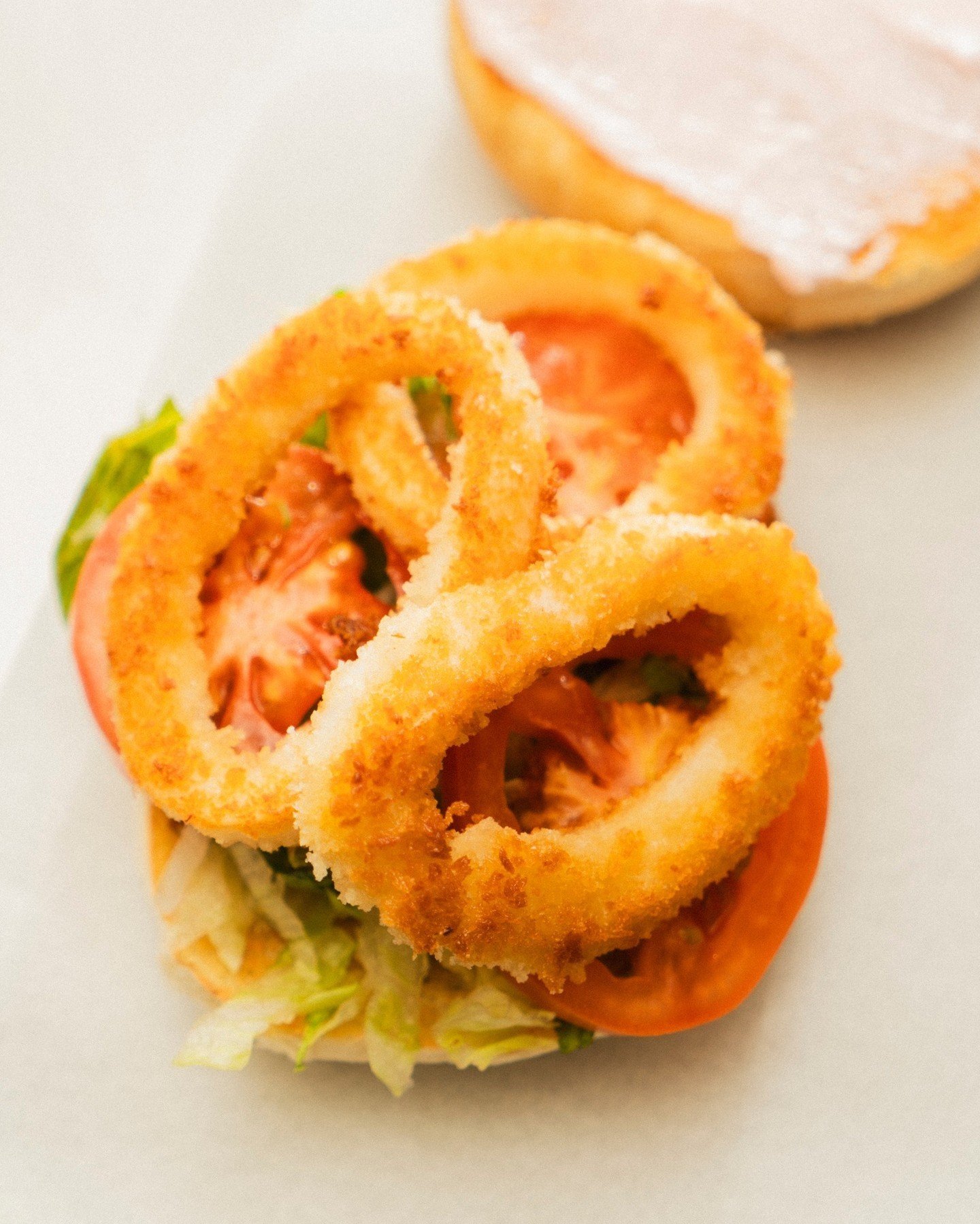 The ultimate comfort food, a burger. But have you ever had a calamari burger?  It doesn't disappoint, and with the quality of fresh Seafood at Shark Tank, you can't go wrong. 🦑⁠
⁠
Enjoy this, and the best meat/fish alternatives at Shark Tank!