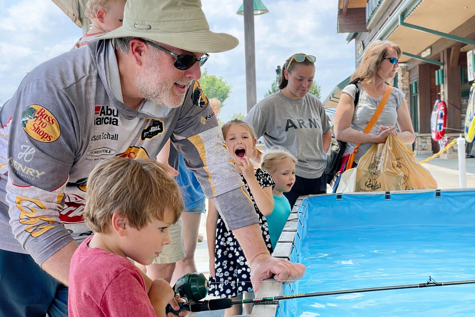 Helping kids catch their first fish at Bass Pro Shops' Gone Fishin' Event!
