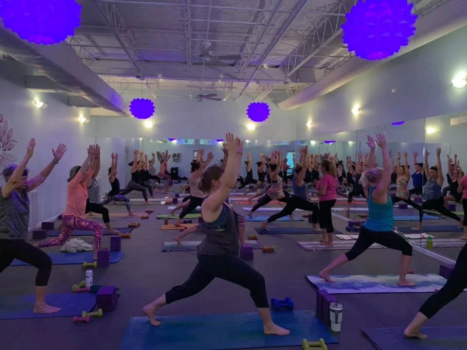 Students practicing yoga in the studio