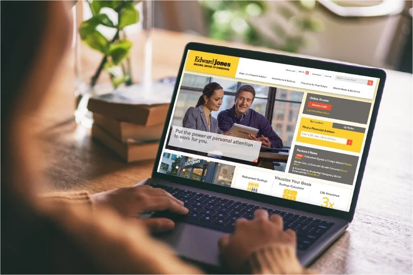 The Edward Jones website open on a laptop.