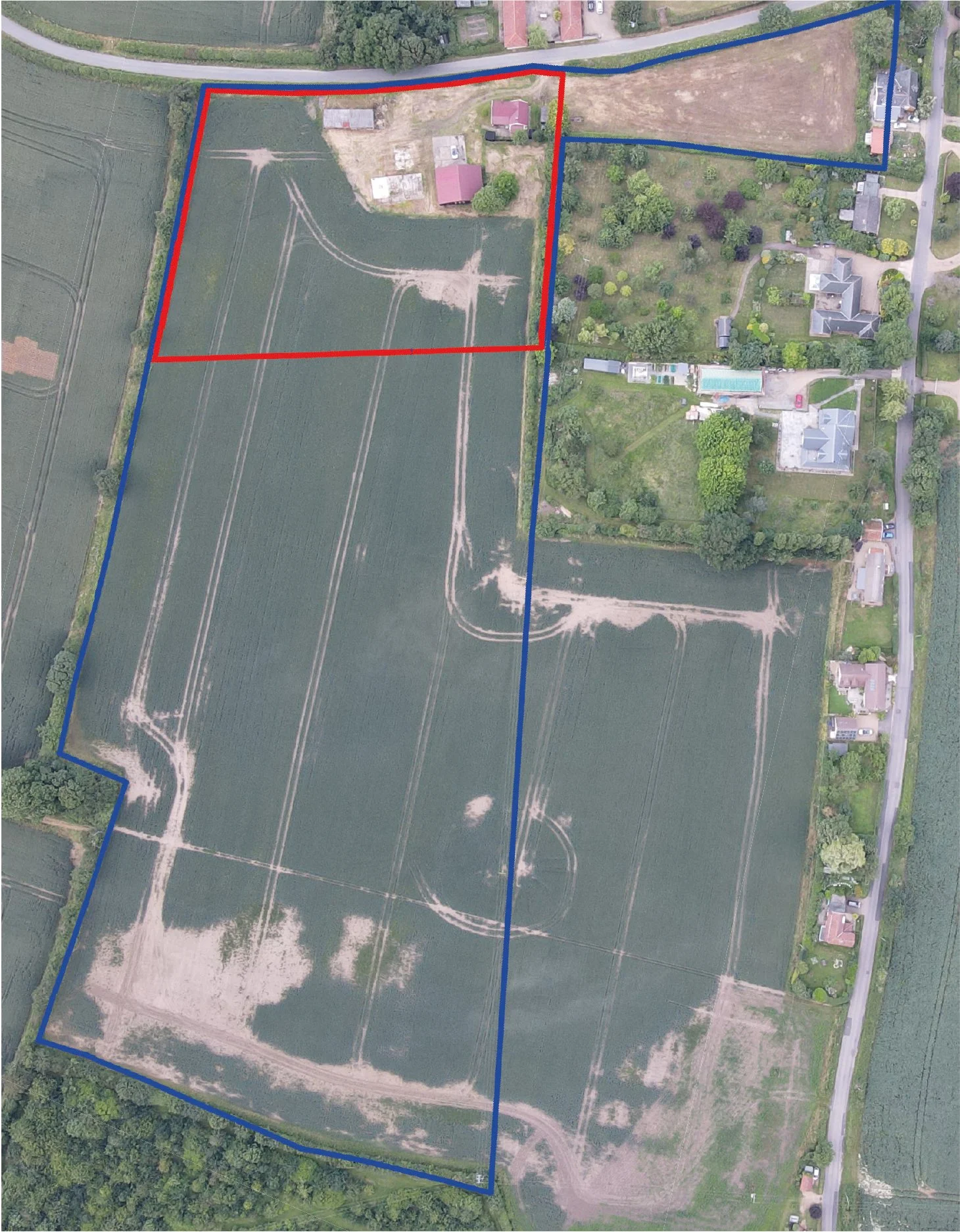 Bungalow Farm – Existing aerial view of the rural Cretingham site in Suffolk showing former agricultural buildings, surrounding farmland and the wider landscape context before redevelopment