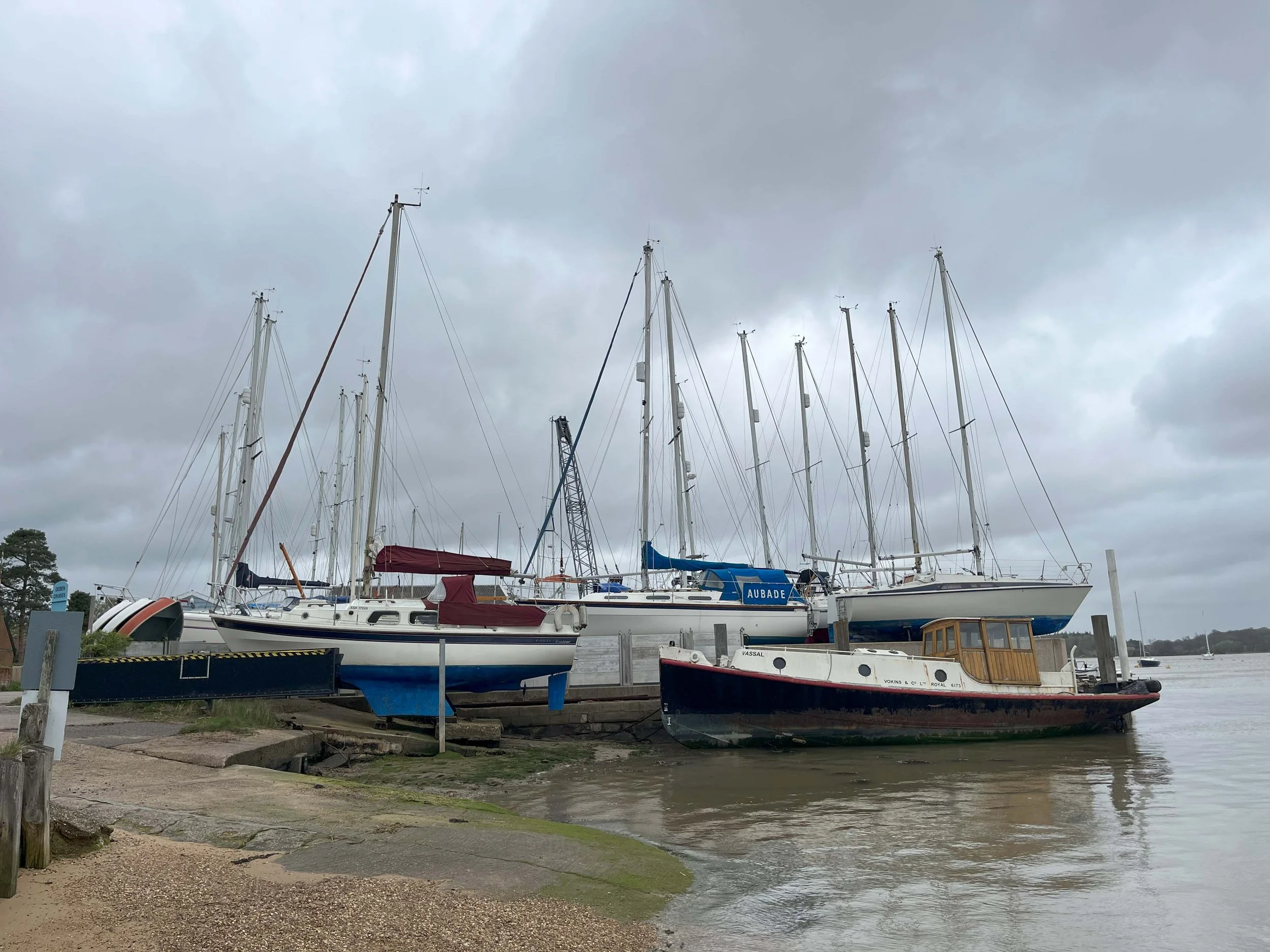 Photo of boats and masts at Waldringfield boatyard, showing the triangular forms that inspire the new dwelling’s design