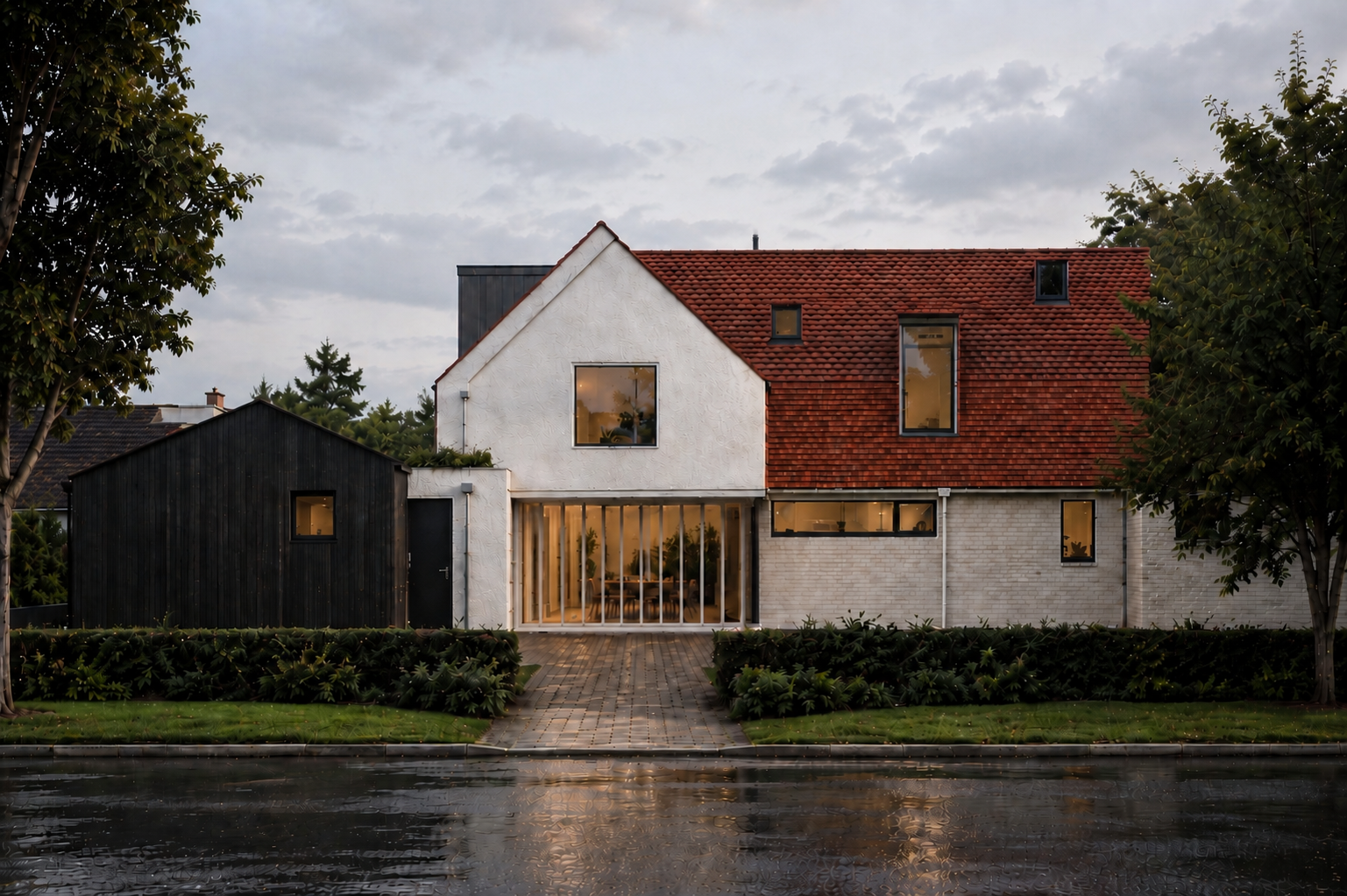 Front elevation of a contemporary extension and renovation project in Whittlesford, Cambridgeshire, featuring white brickwork, black timber cladding and clay roof tiles.