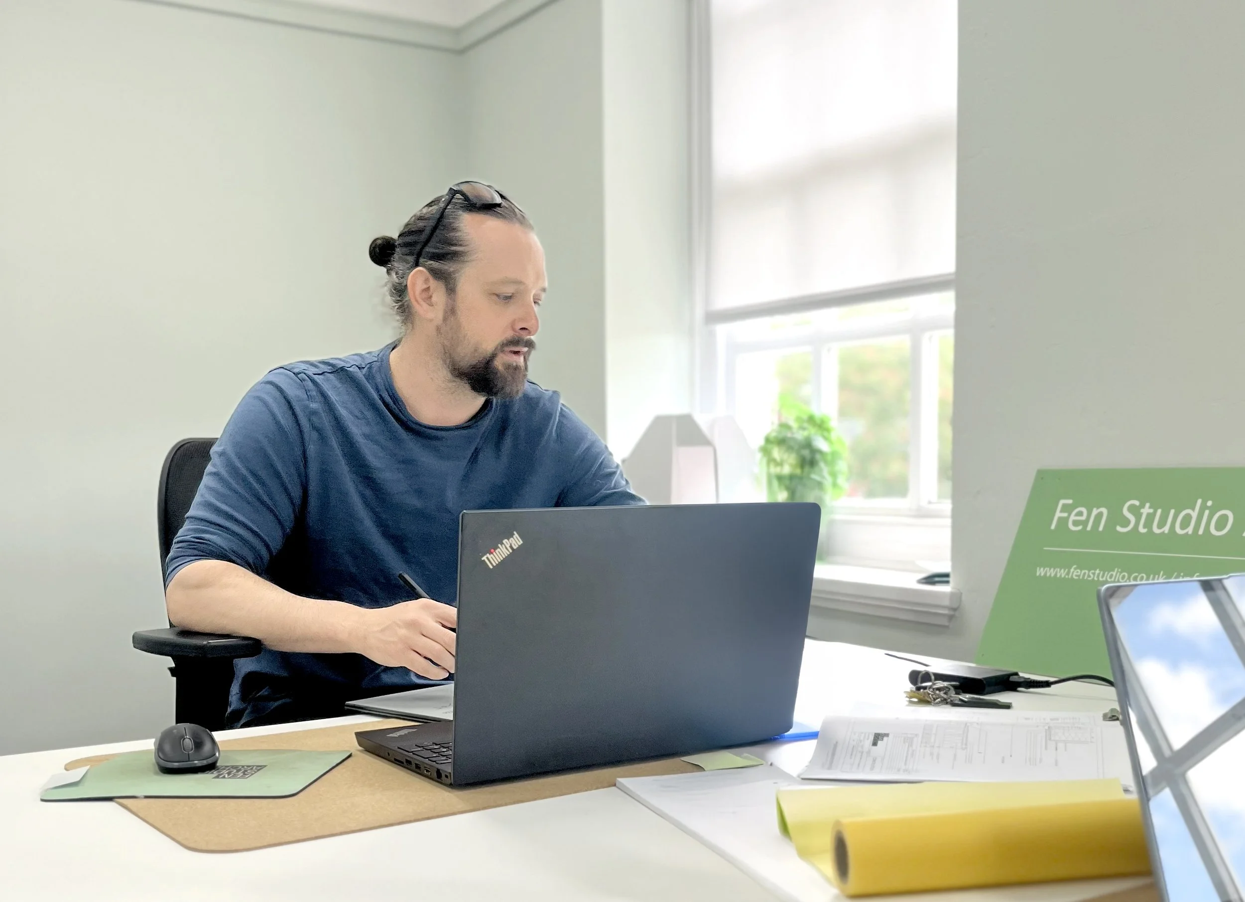 Joseph Gautrey of Fen Studio Architects working in the studio office