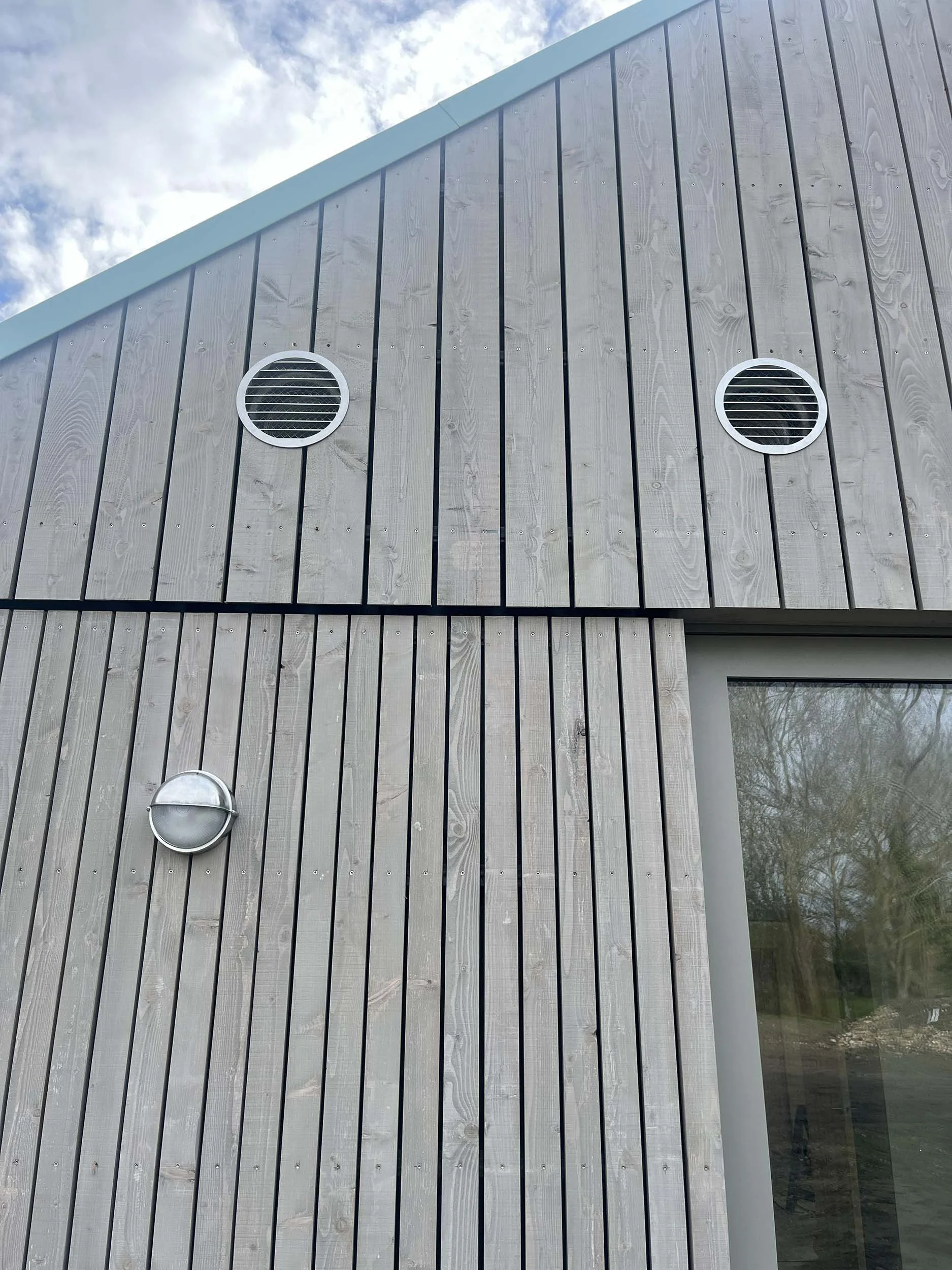 Hereward House – Vertical timber cladding detail of certified Passive House in Aldreth, Ely, Cambridgeshire