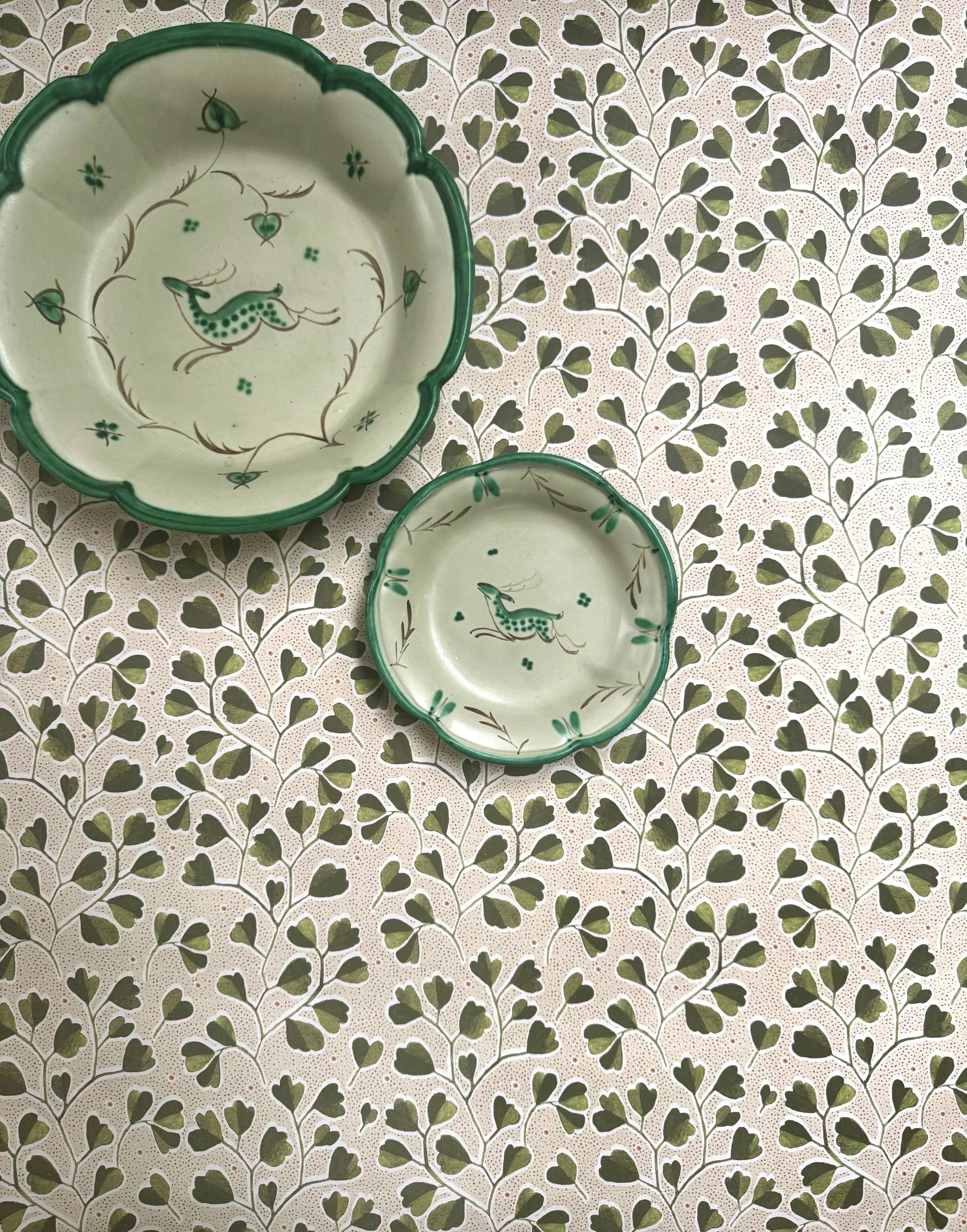 wallpaper with a green painterly leafy patter