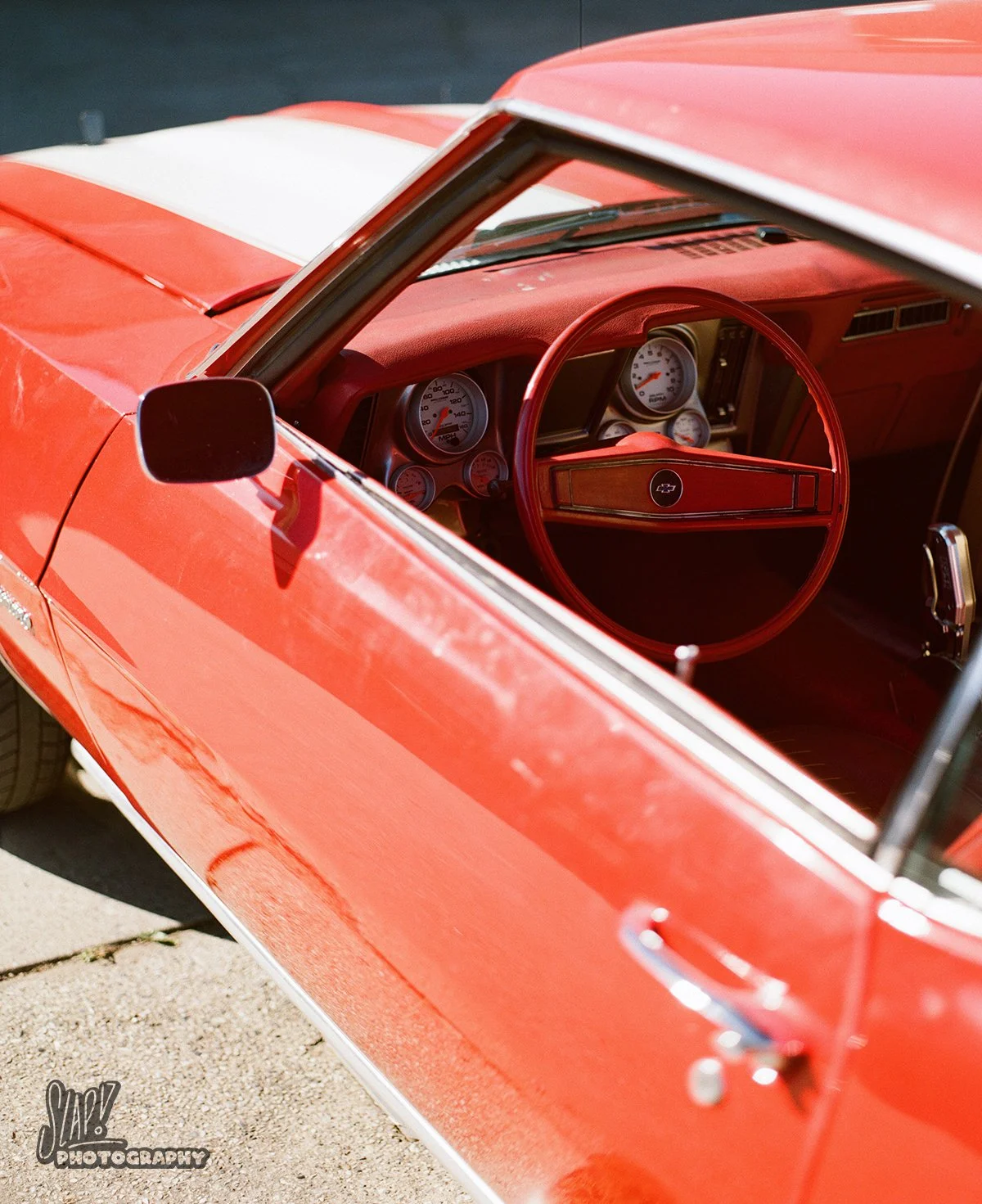 Red Chevrolet Camaro Side with Interior and Dashboard